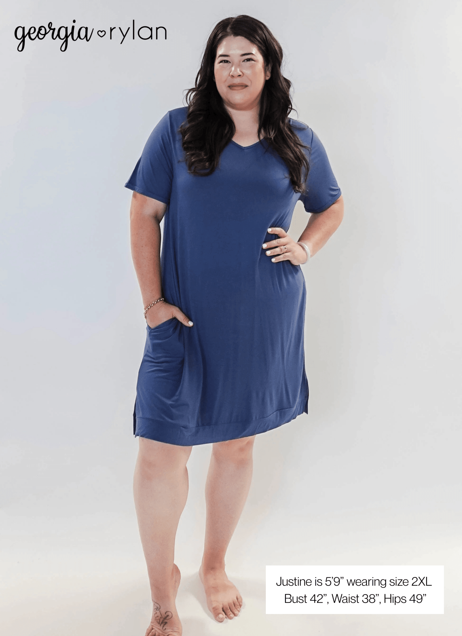 Stylish model wearing Denim Blue V Neck Bamboo Nightshirt dress with pockets, showcasing versatility in sleepwear and everyday fashion.