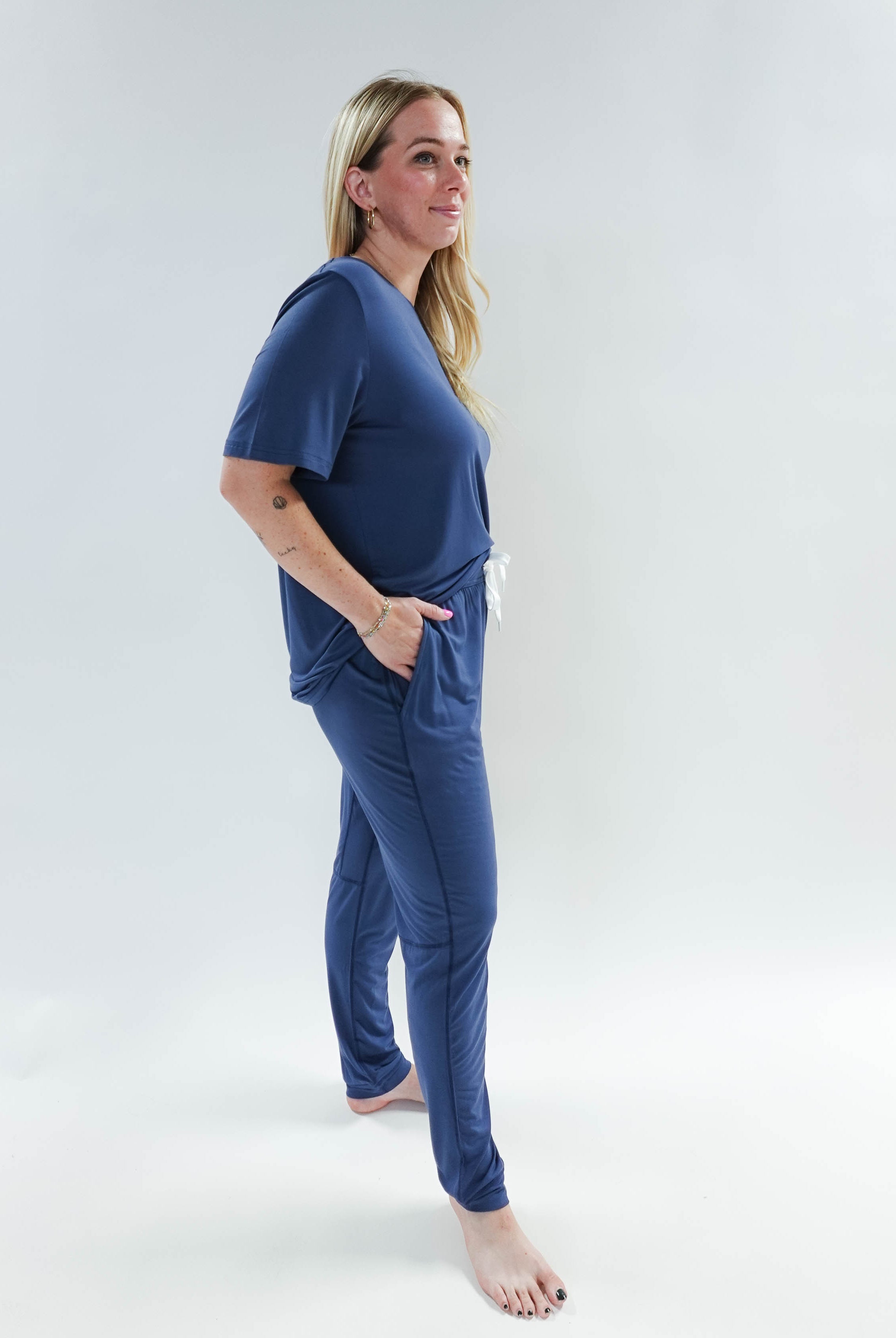 Model wearing Denim Blue Unisex Bamboo Jogger from Bob's Sleepwear Co., showcasing comfort and style.