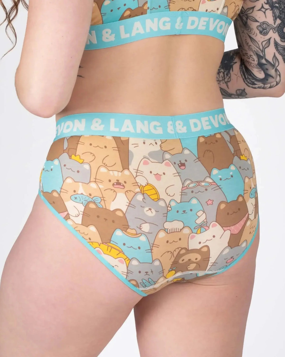 Devon + Lang Bria Full Coverage Bikini Brief showcasing a playful cat print design on a model.