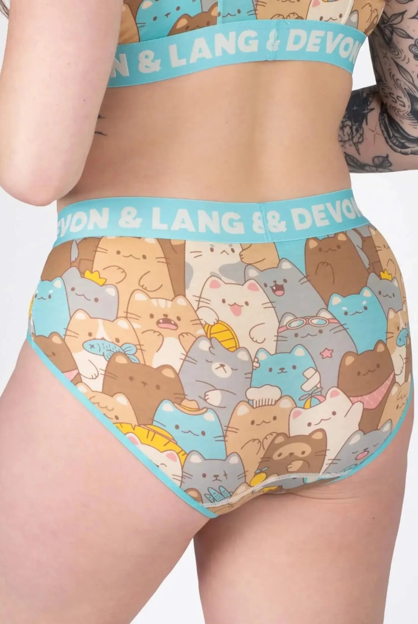 Devon + Lang Bria Full Coverage Bikini Brief showcasing a playful cat print design on a model.