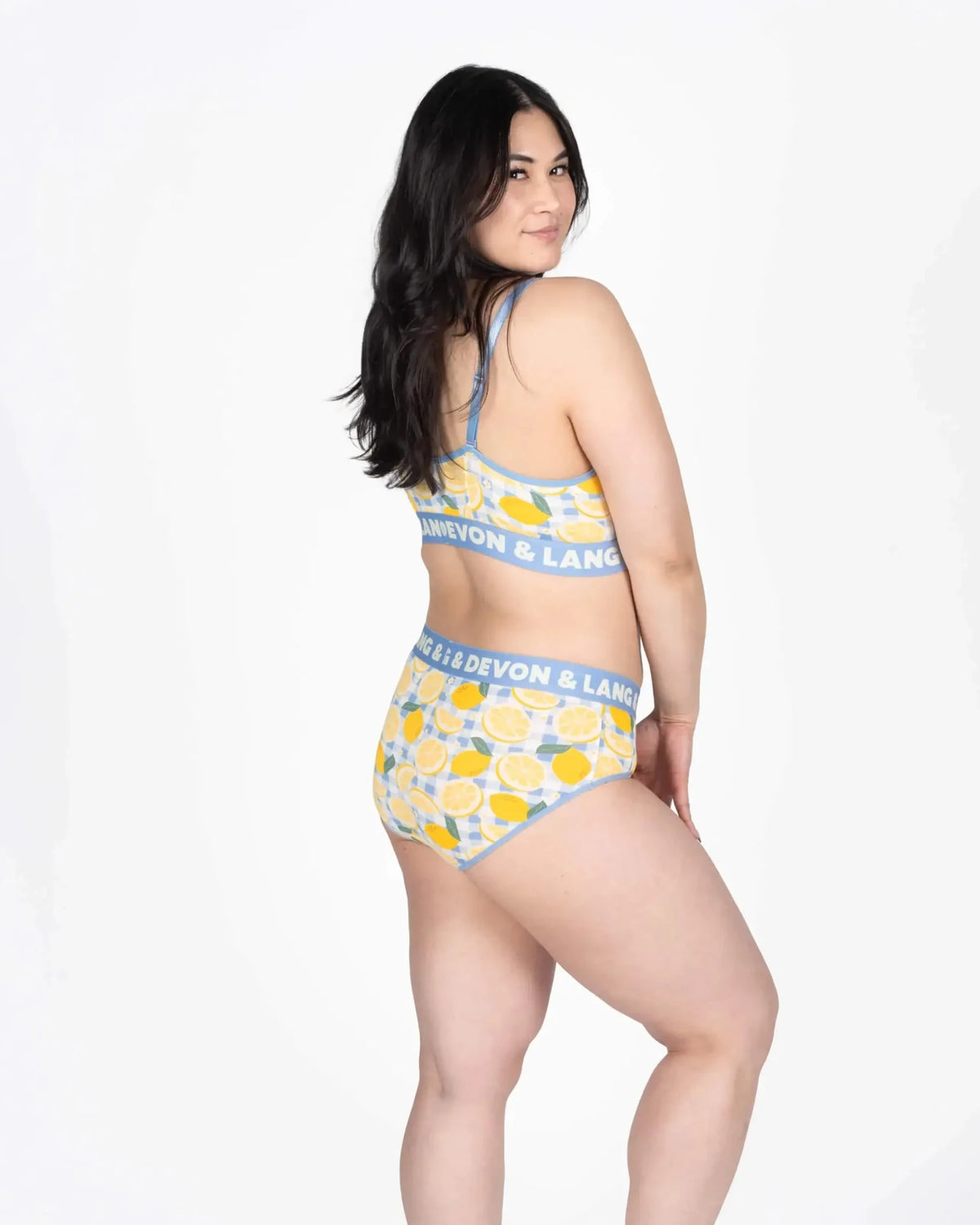 Devon + Lang Bria Full Coverage Bikini Brief in a vibrant lemon pattern, showcased on a model from the side.