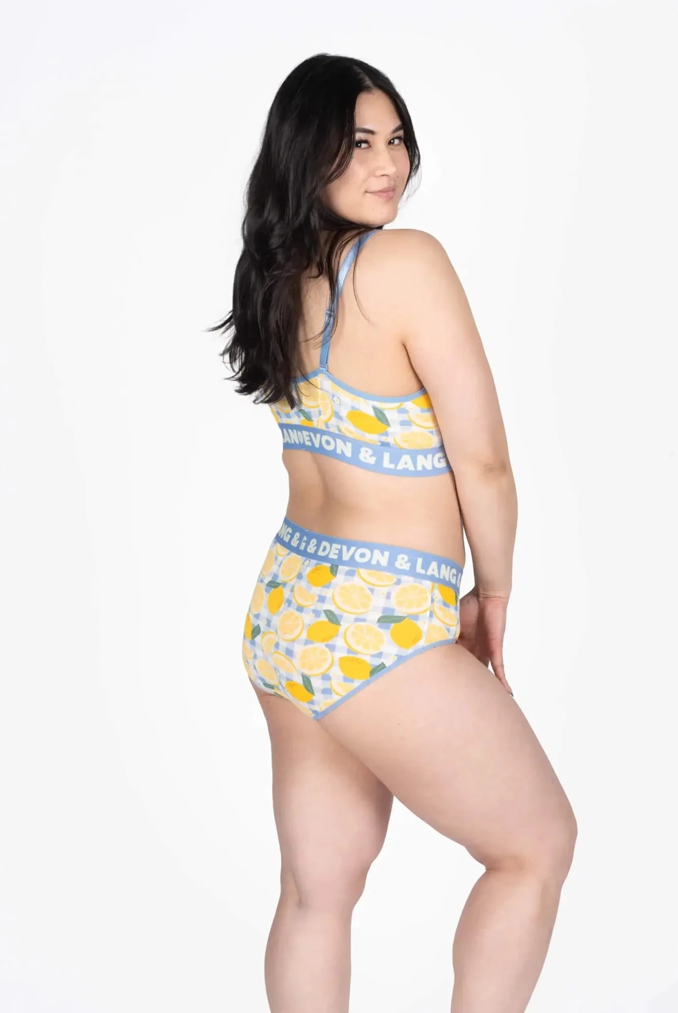 Devon + Lang Bria Full Coverage Bikini Brief in a vibrant lemon pattern, showcased on a model from the side.