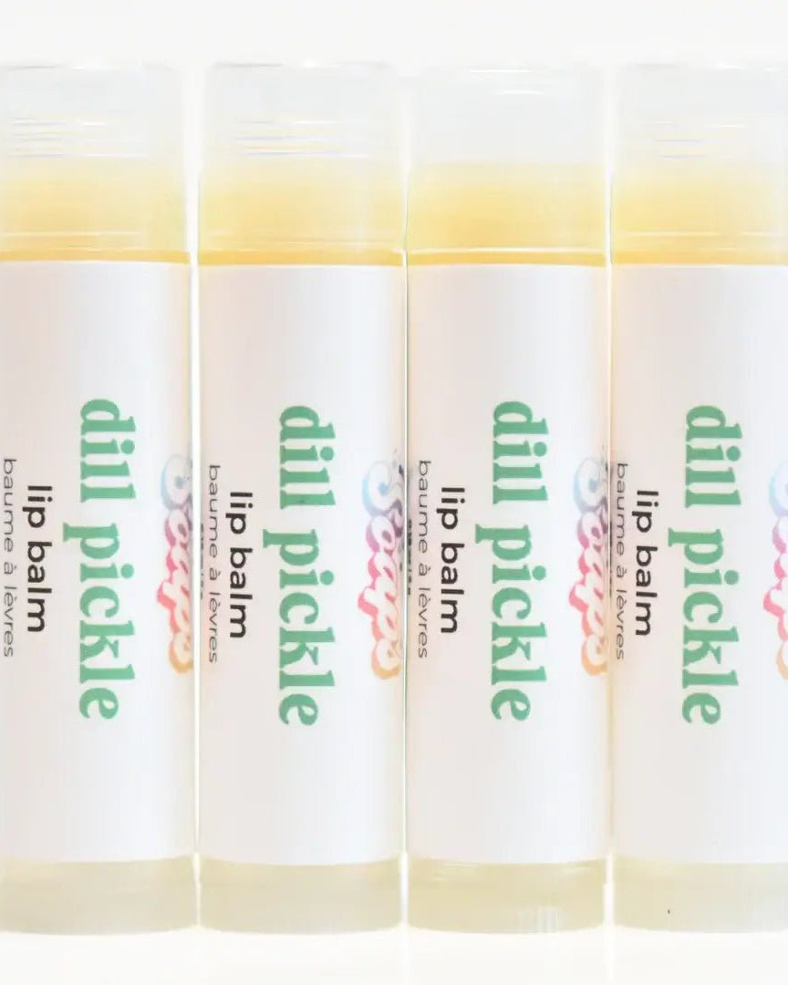 Dill Pickle Lip Balm tubes arranged in a row, featuring a crunchy dill pickle flavor and hydrating ingredients.