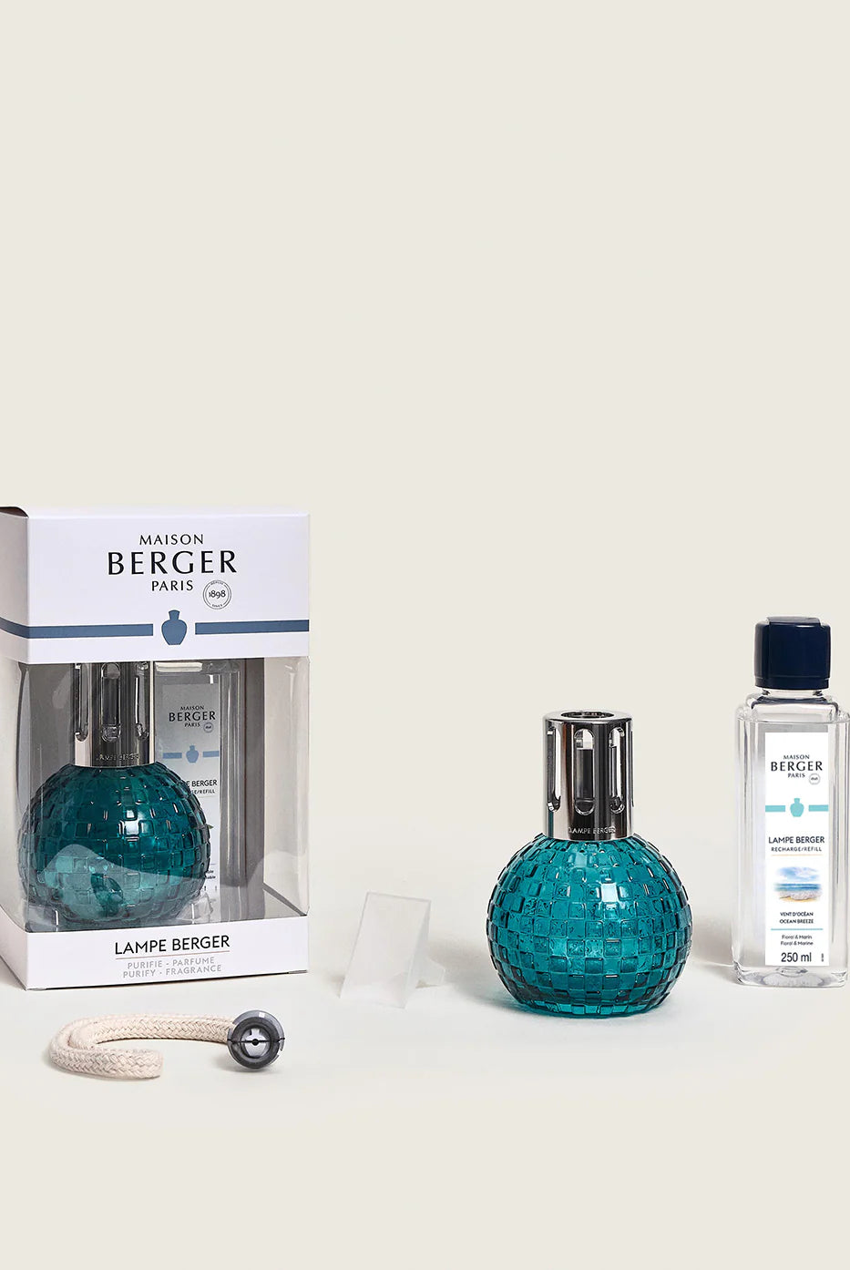 Maison Berger Paris Disco Fragrance Lamp Gift Set in teal, with fragrance bottle and packaging on display.