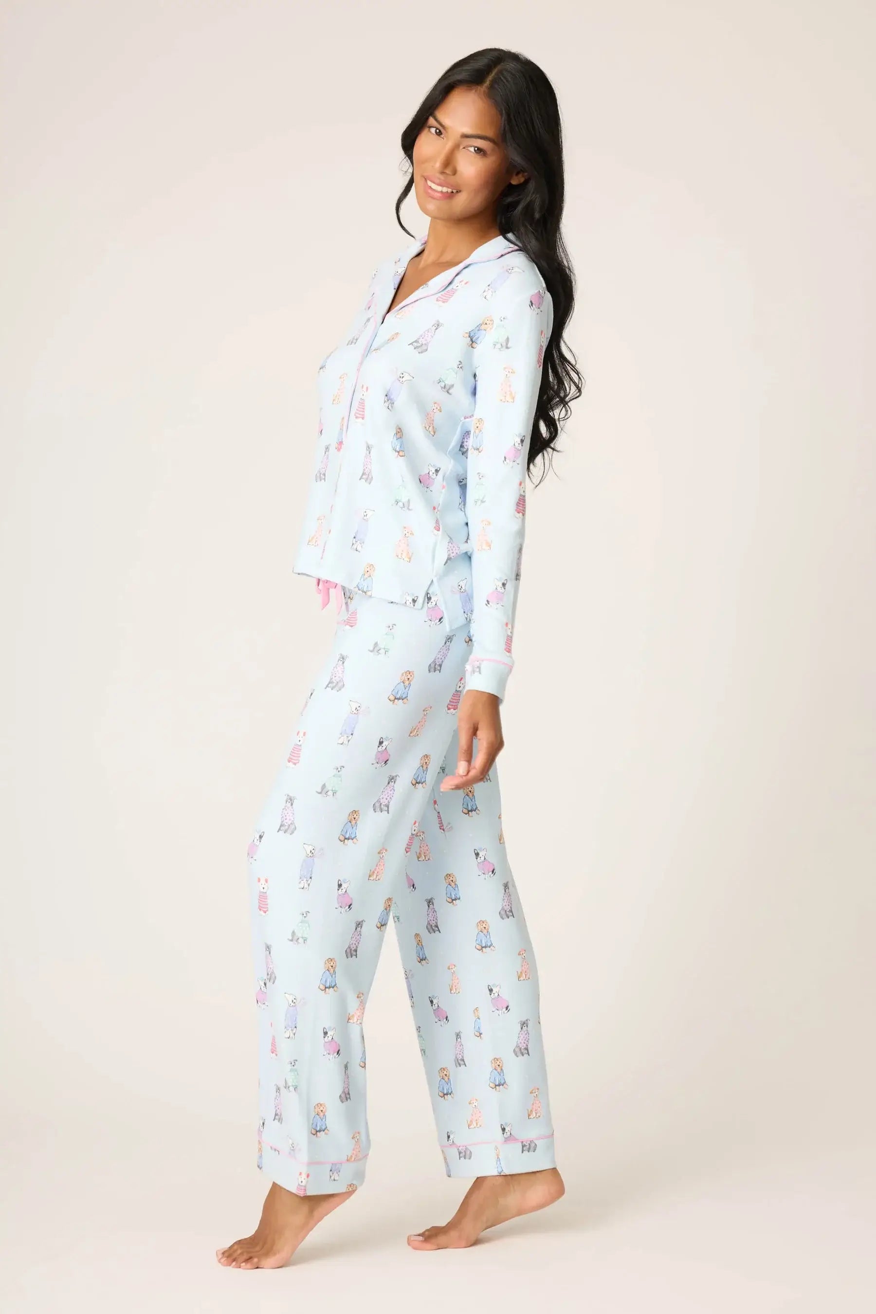 Model wearing Doggone Cold Pointelle PJ Set by PJ Salvage, featuring dog print design and button-up top with straight pants.