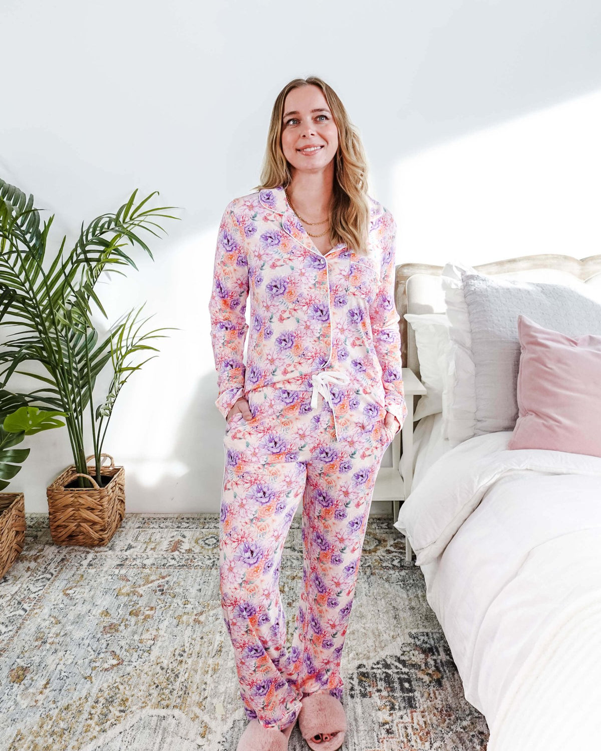 Woman wearing the Dream in Blooms Long Sleeve Button Up & Pant Bamboo Lounge Set in a bright room.