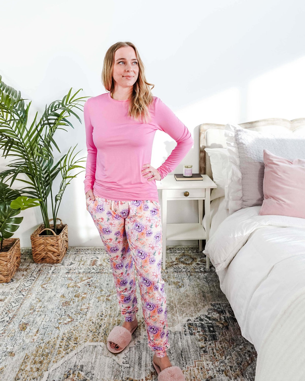 Woman wearing Dream In Blooms Long Sleeve Top & Jogger Bamboo Lounge Set in a cozy bedroom setting.