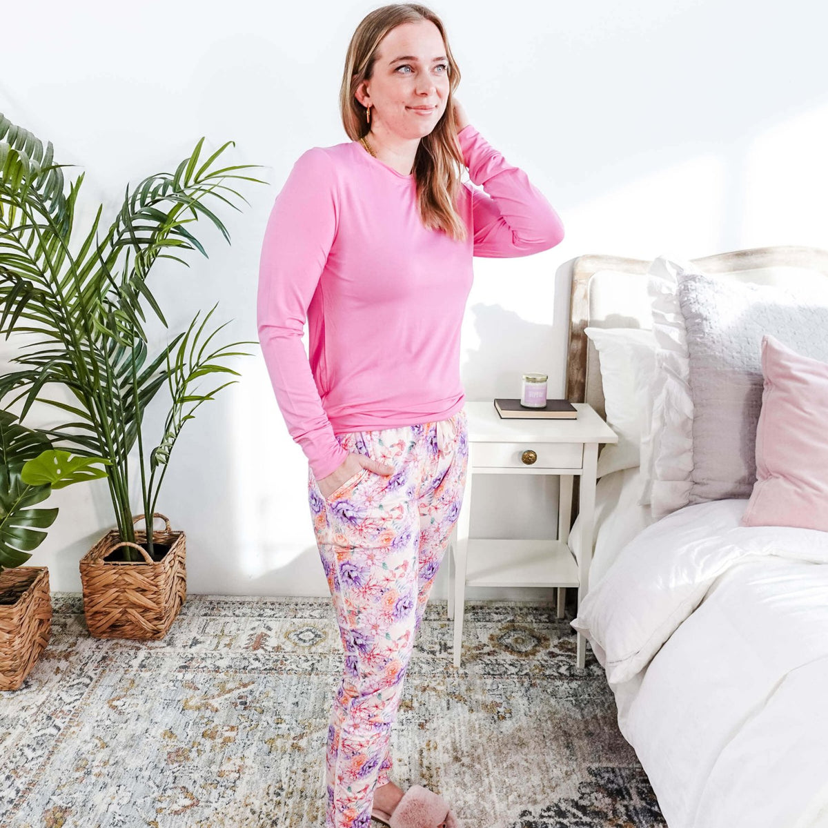 Woman wearing Dream In Blooms Long Sleeve Top & Jogger Bamboo Lounge Set in a cozy bedroom.