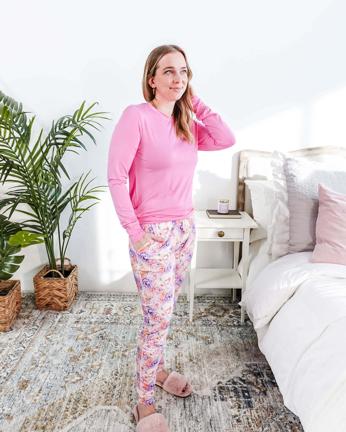 Woman wearing Dream In Blooms Long Sleeve Top & Jogger Bamboo Lounge Set in a cozy bedroom.