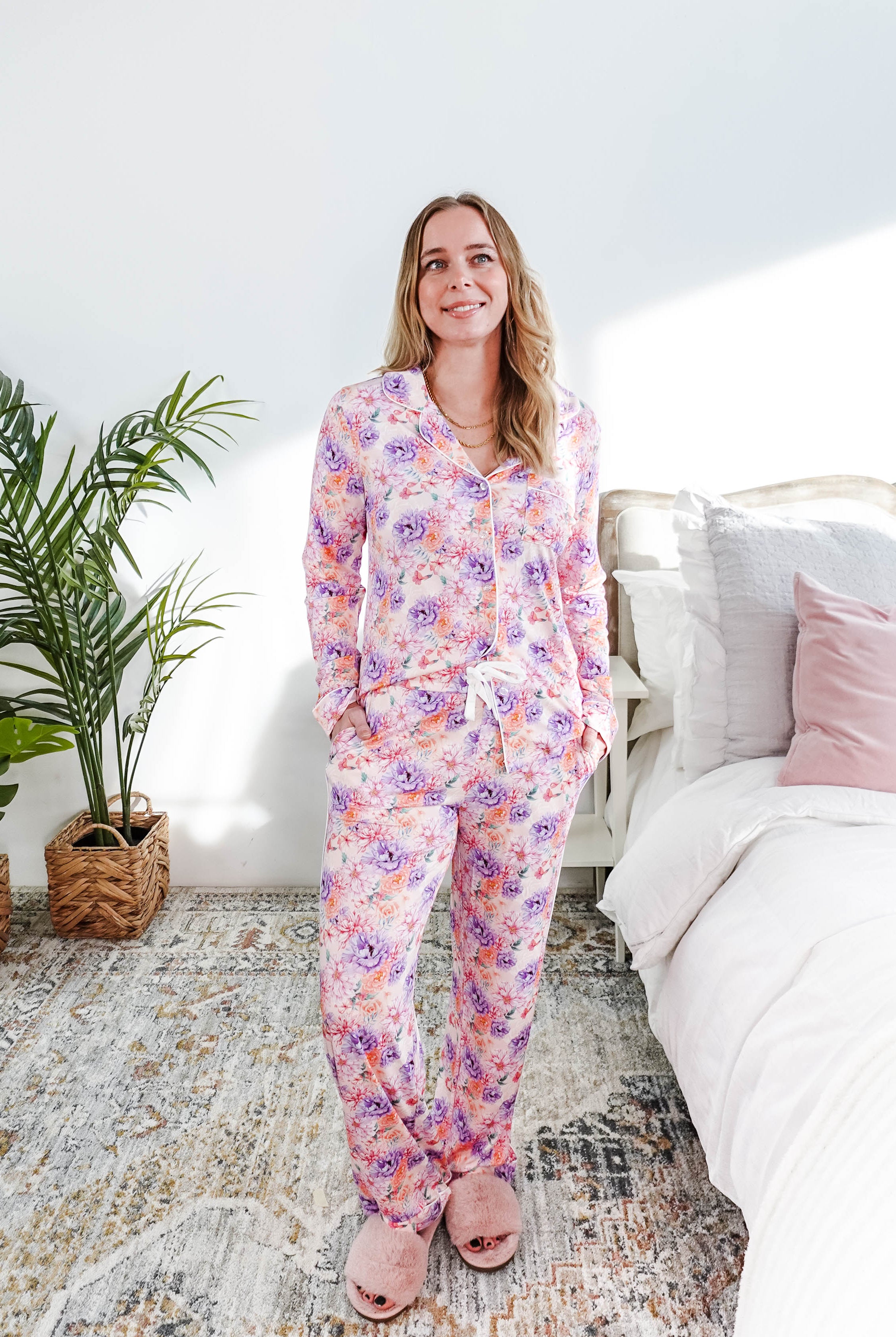 Woman wearing the Dream in Blooms Long Sleeve Button Up & Pant Bamboo Lounge Set in a bright room.