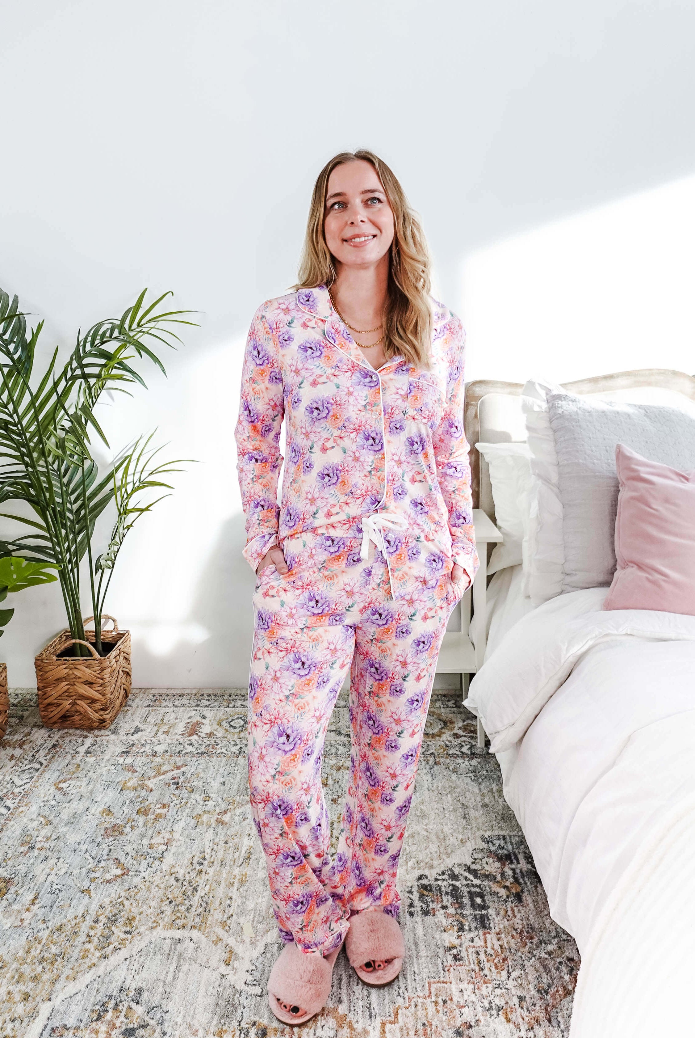 Woman wearing the Dream in Blooms Long Sleeve Button Up & Pant Bamboo Lounge Set in a bright room.