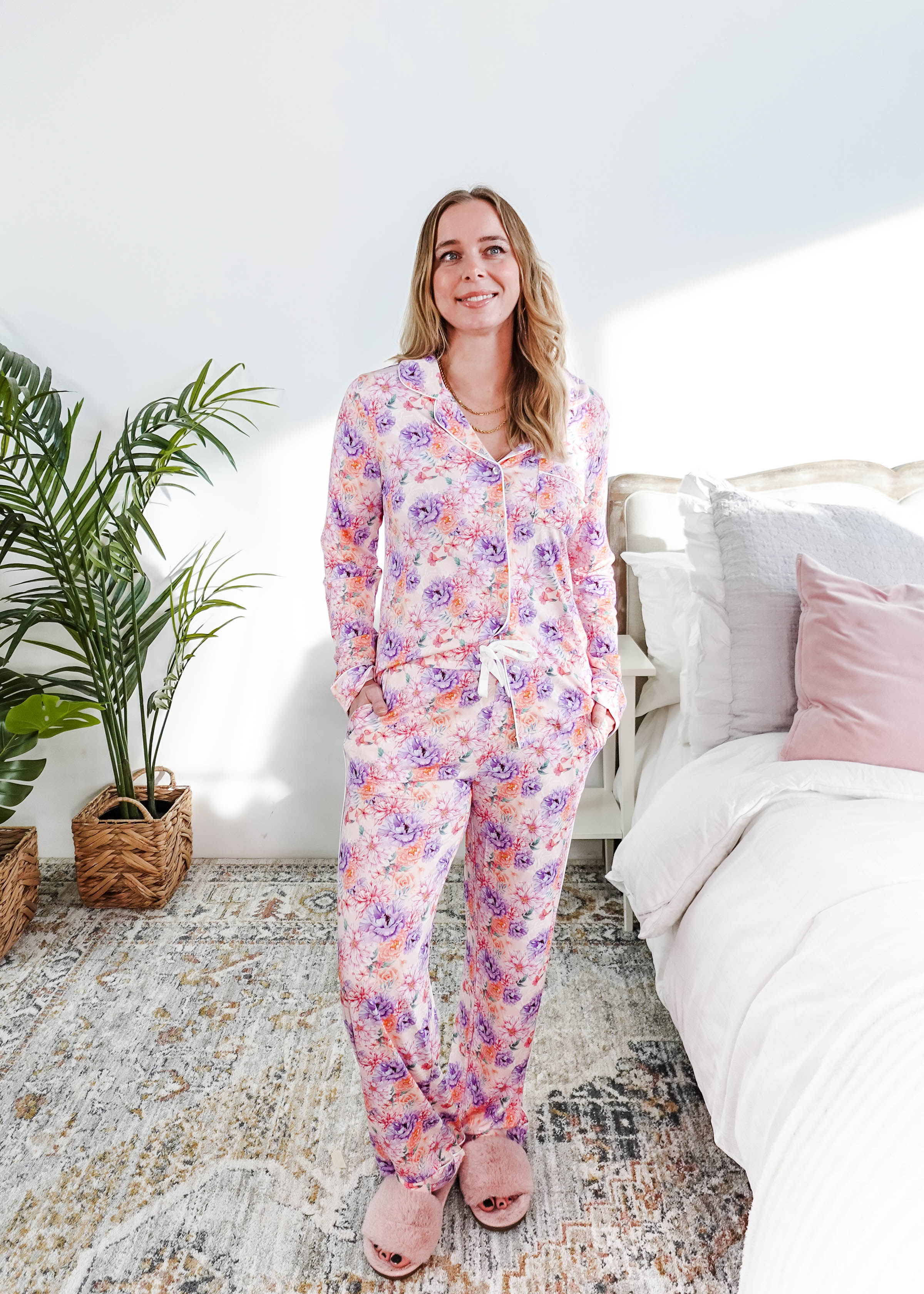 Woman wearing the Dream in Blooms Long Sleeve Button Up & Pant Bamboo Lounge Set in a bright room.