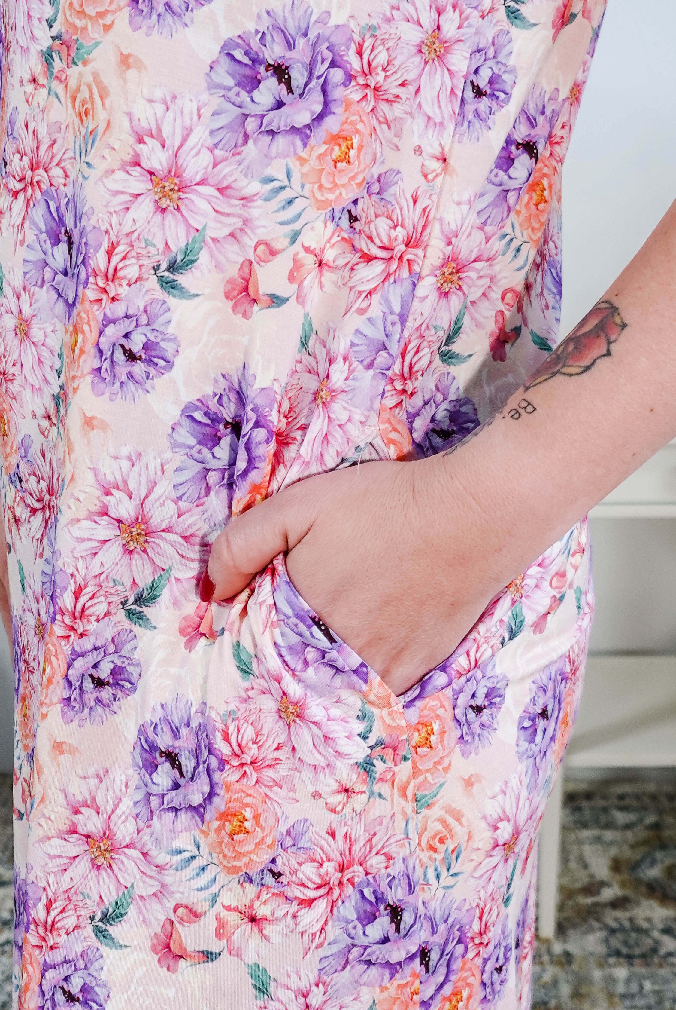 Dream in Blooms V Neck Nightshirt With Pockets featuring vibrant floral print and convenient side pockets.