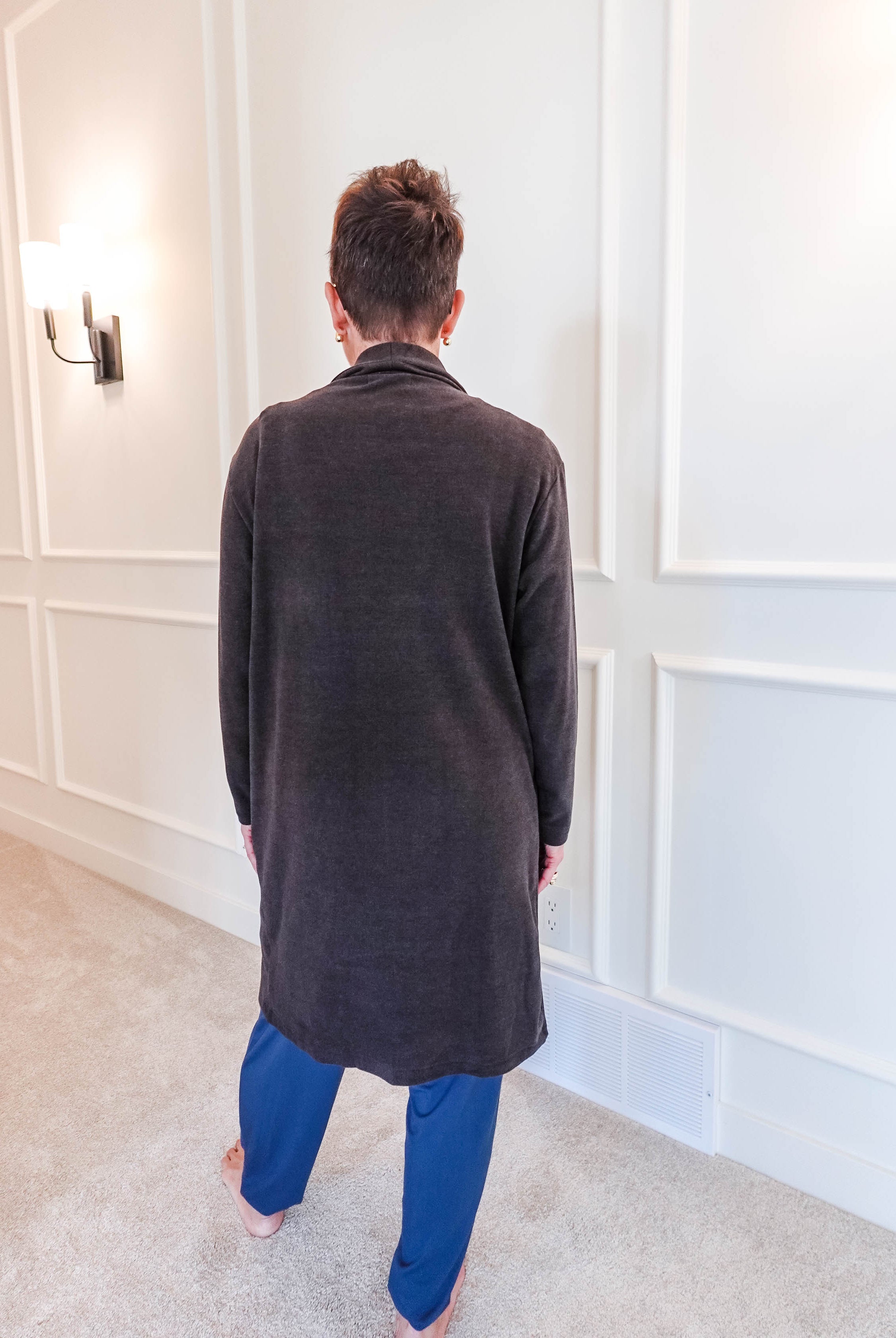 Back view of the Charcoal Elevate Cardigan showing the elegant drape and length of the long, structured layering piece.