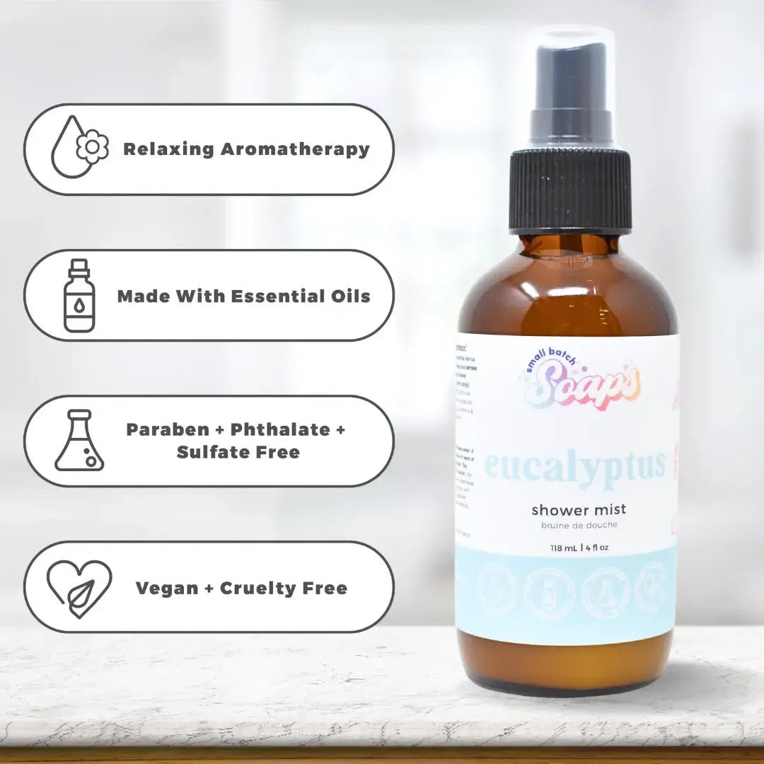 Eucalyptus Shower Mist bottle with labels highlighting essential oils and vegan ingredients on a light background.