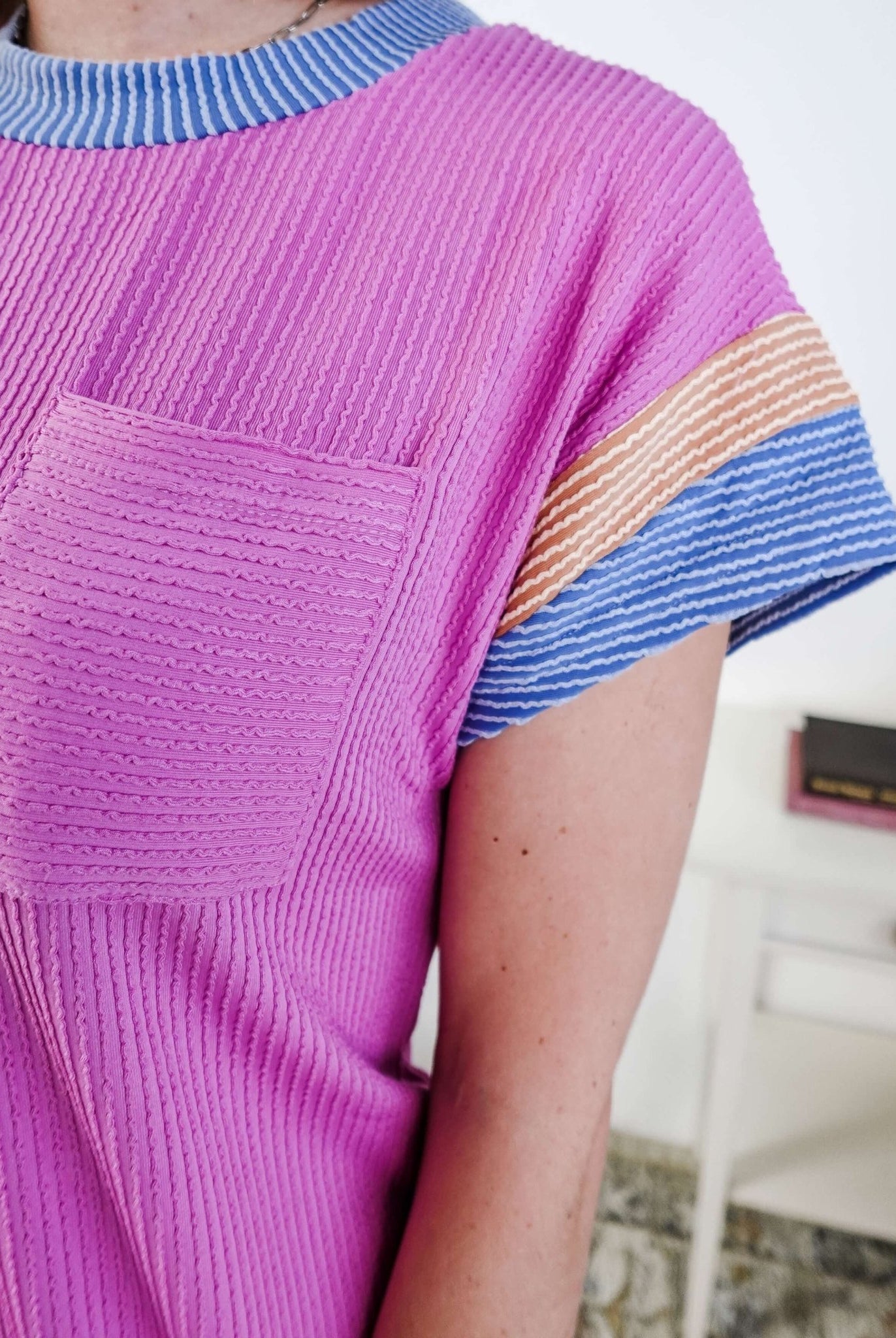 Close up of a woman wearing a pink dress with purple and peach sleeve dress with pocket in a bedroom setting, Scarlett Ellie Everyday Relaxed T-Shirt Dress | Cloud Nine Pajamas