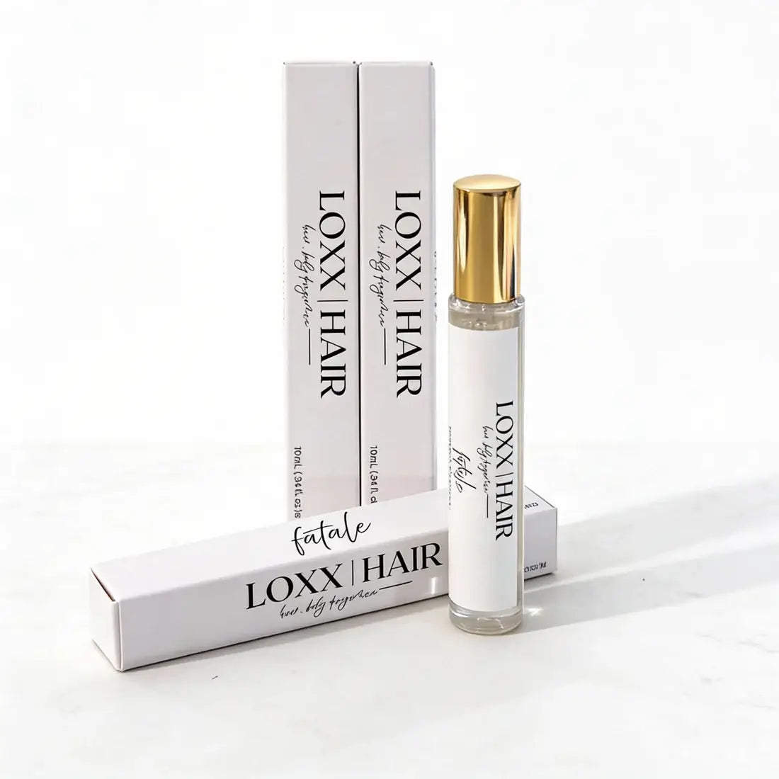 LOXX Fatale Hair & Body Fragrance – 10mL travel size bottle and packaging on display.