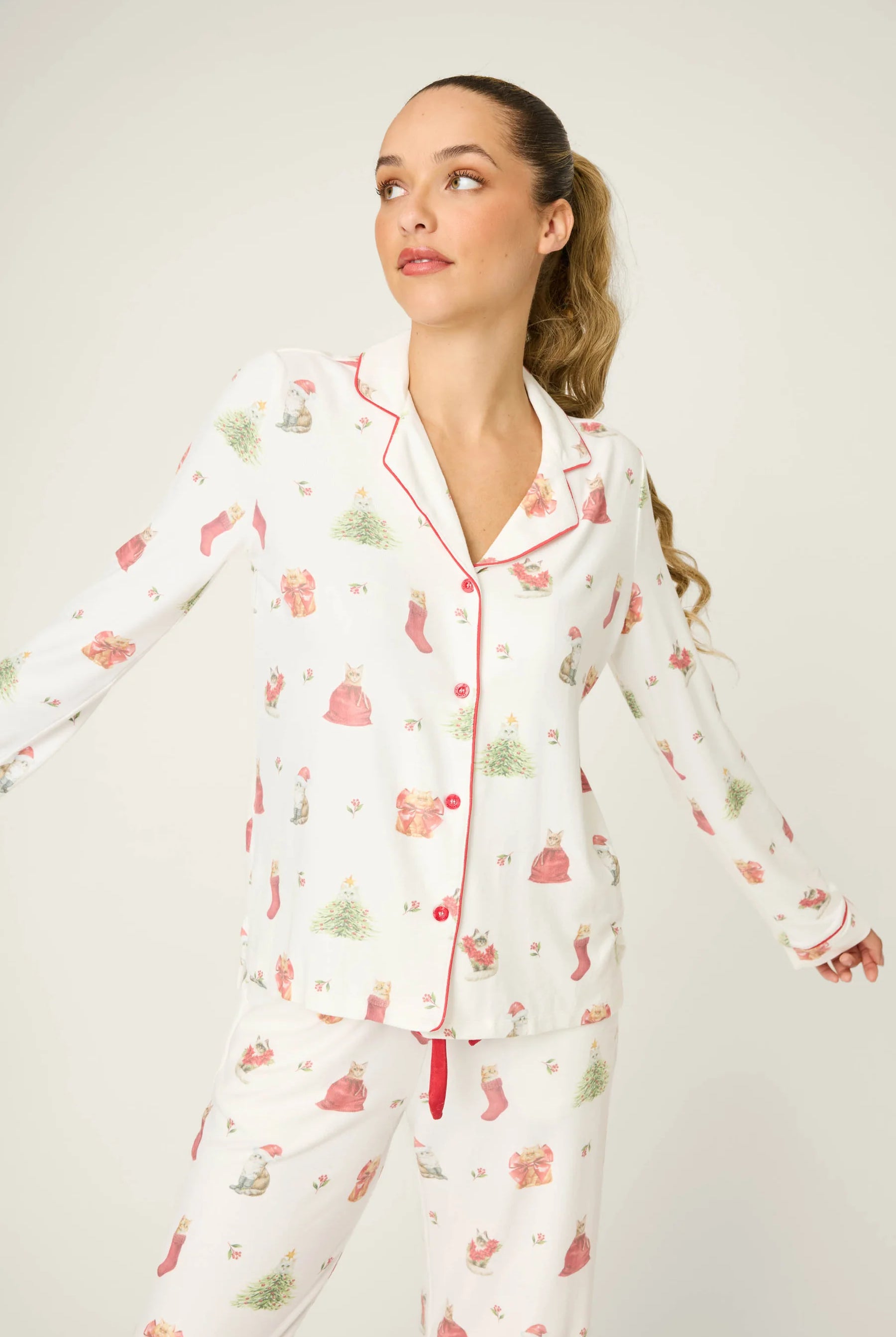 Feline Festive Cat Print PJ Set by PJ Salvage with cat and christmas bauble prints like presents, stockings and christmas trees on ivory background