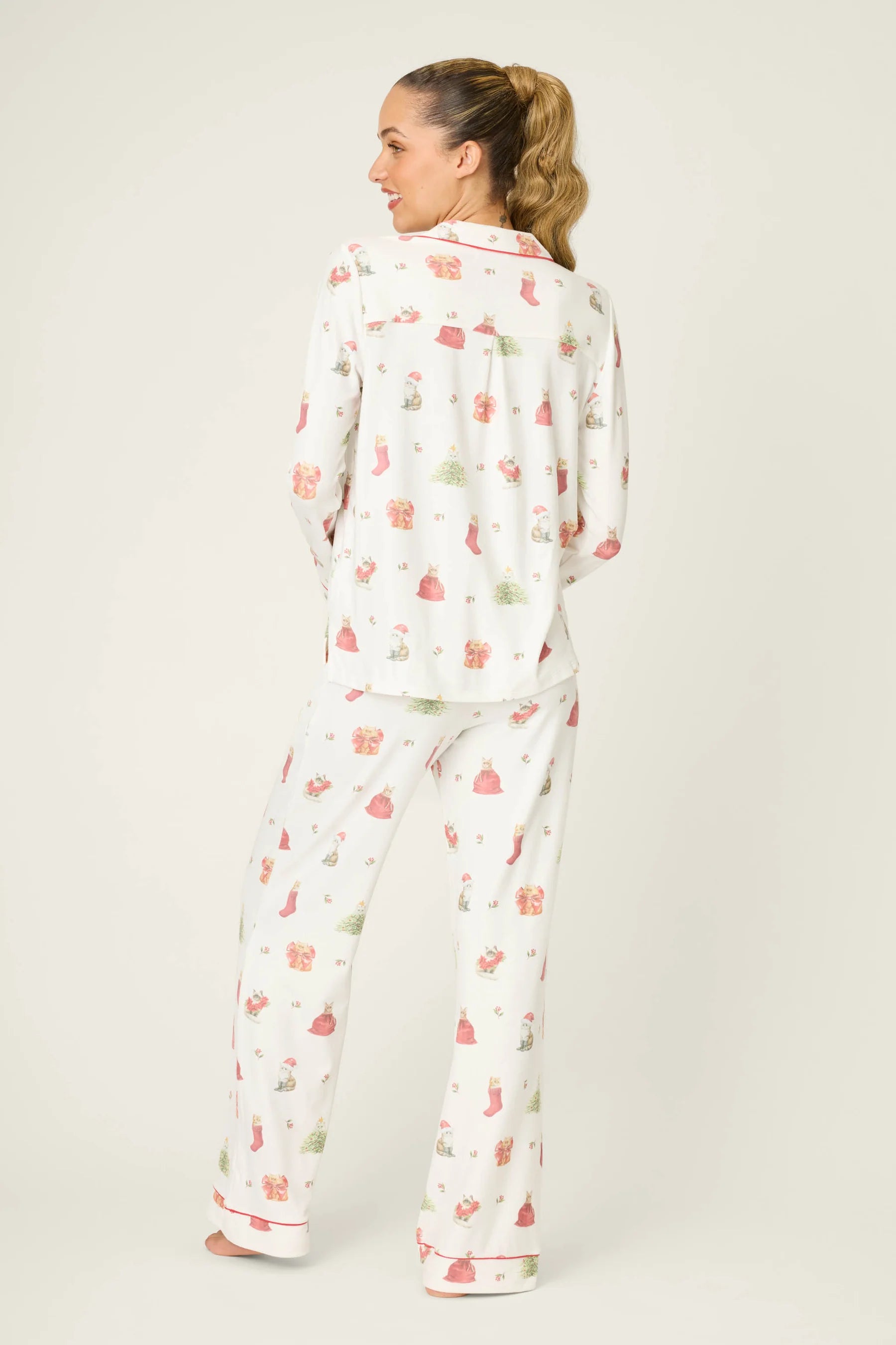 Feline Festive Cat Print PJ Set by PJ Salvage with cat and christmas bauble prints like presents, stockings and christmas trees on ivory background