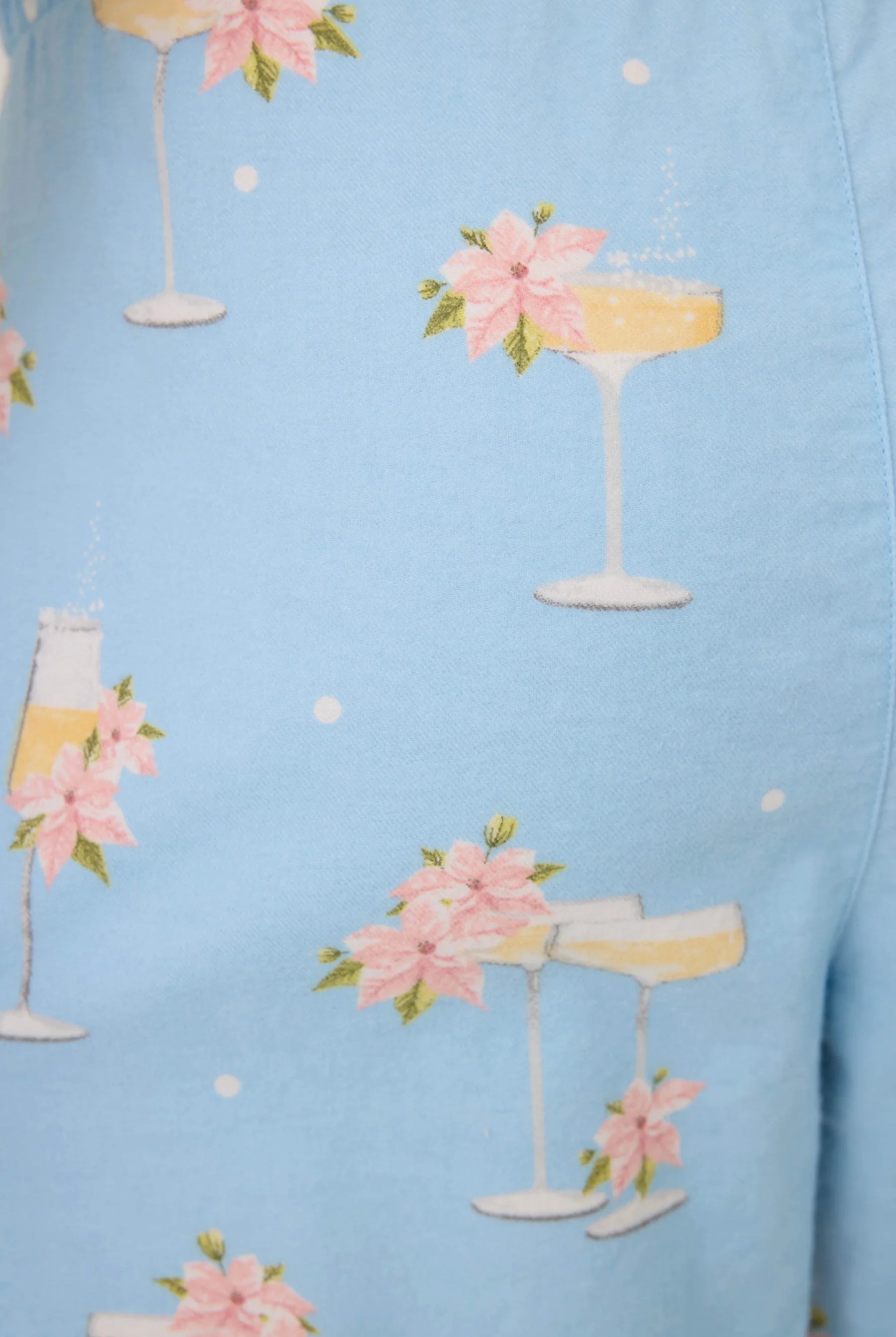 Fizz The Season Flannel Set | PJ Salvage Champagne Print Button-Up Pajamas women's light blue flannel pajamas with champagne and poinsettia print