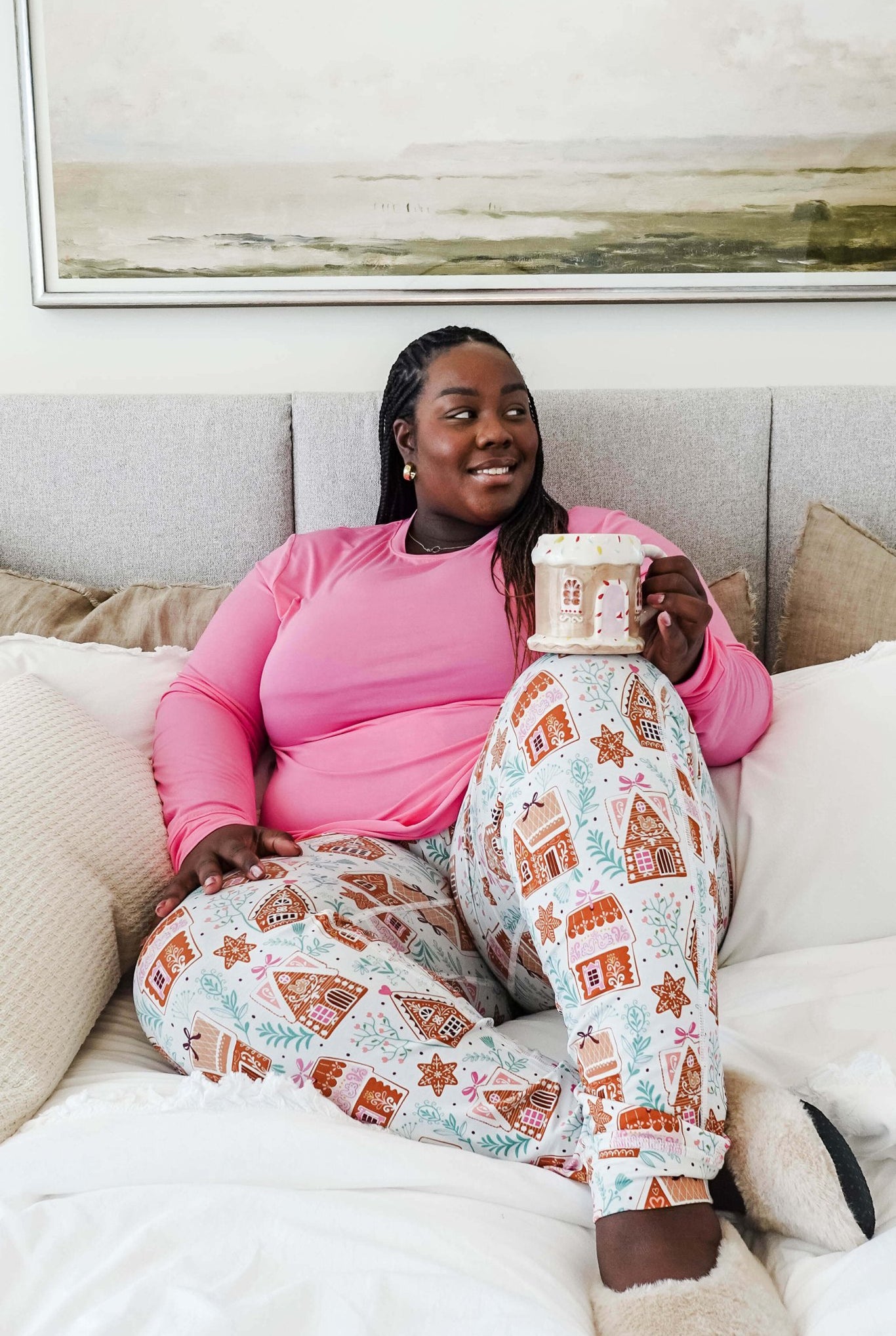 Cozy scene featuring a model enjoying a drink in Gingerbread Dreams Long Sleeve & Jogger PJ Set Bamboo by Georgia Rylan.