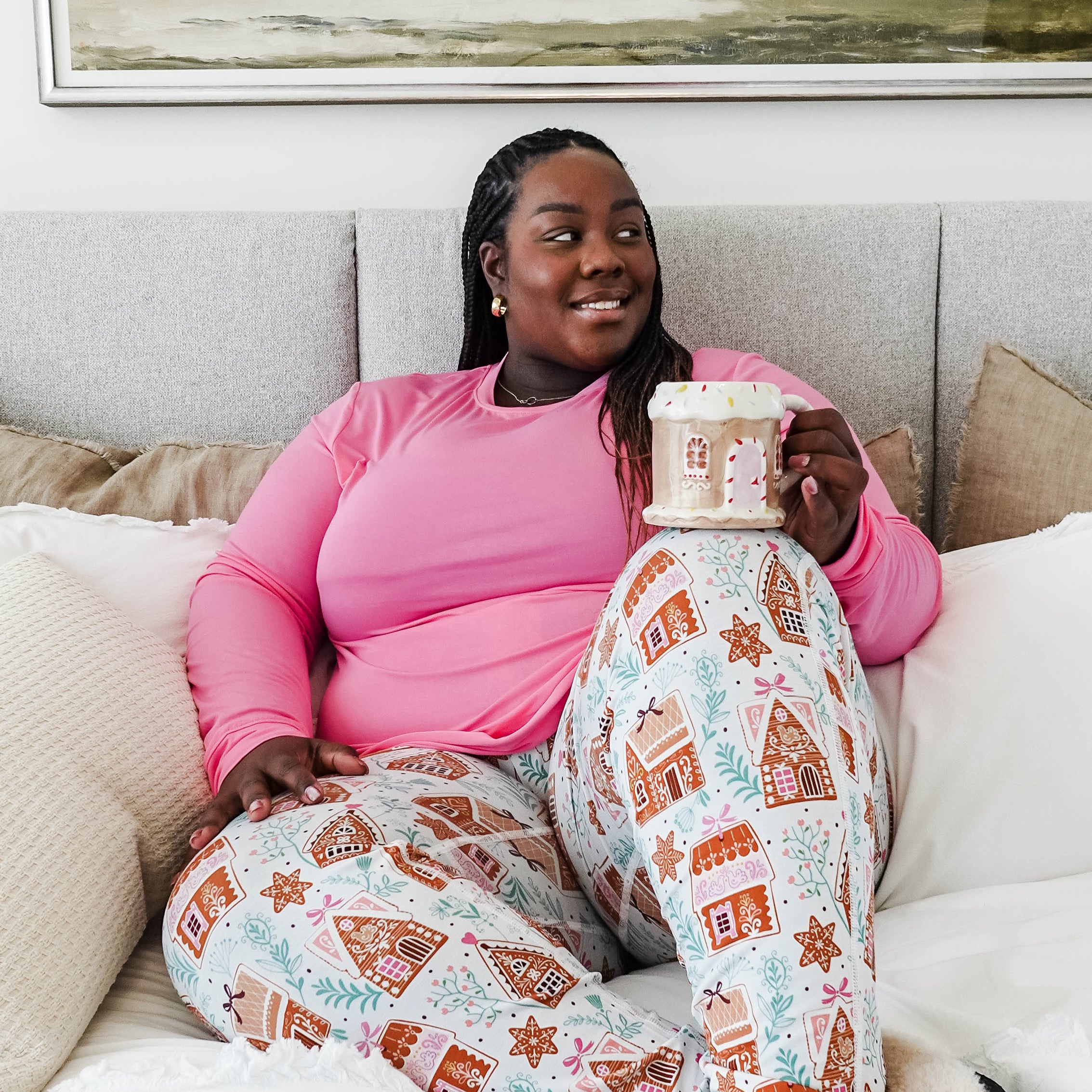Cozy scene featuring a model enjoying a drink in Gingerbread Dreams Long Sleeve & Jogger PJ Set Bamboo by Georgia Rylan.