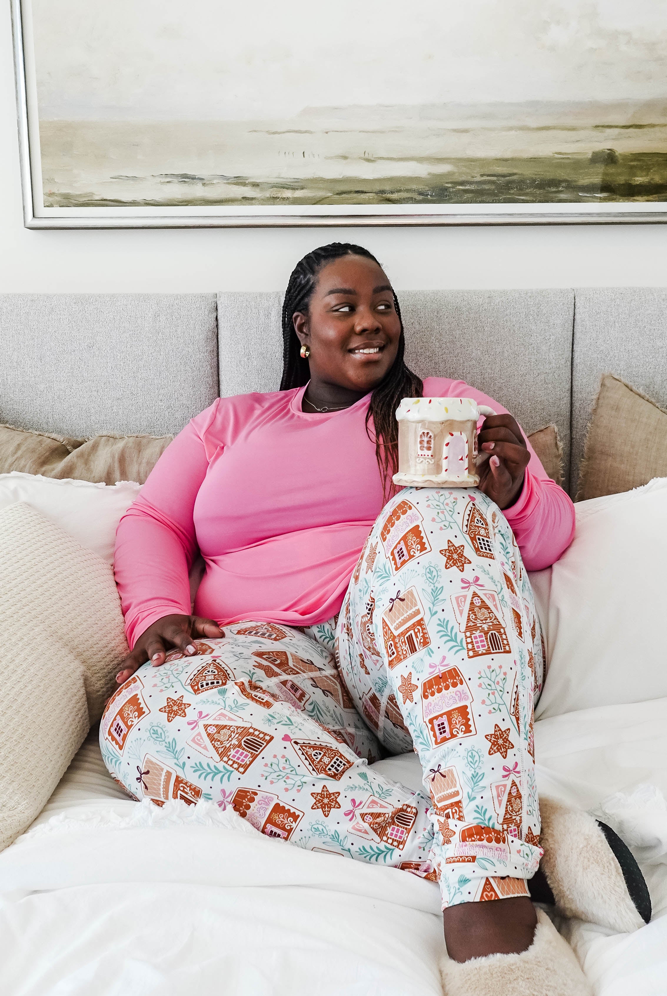 Cozy scene featuring a model enjoying a drink in Gingerbread Dreams Long Sleeve & Jogger PJ Set Bamboo by Georgia Rylan.