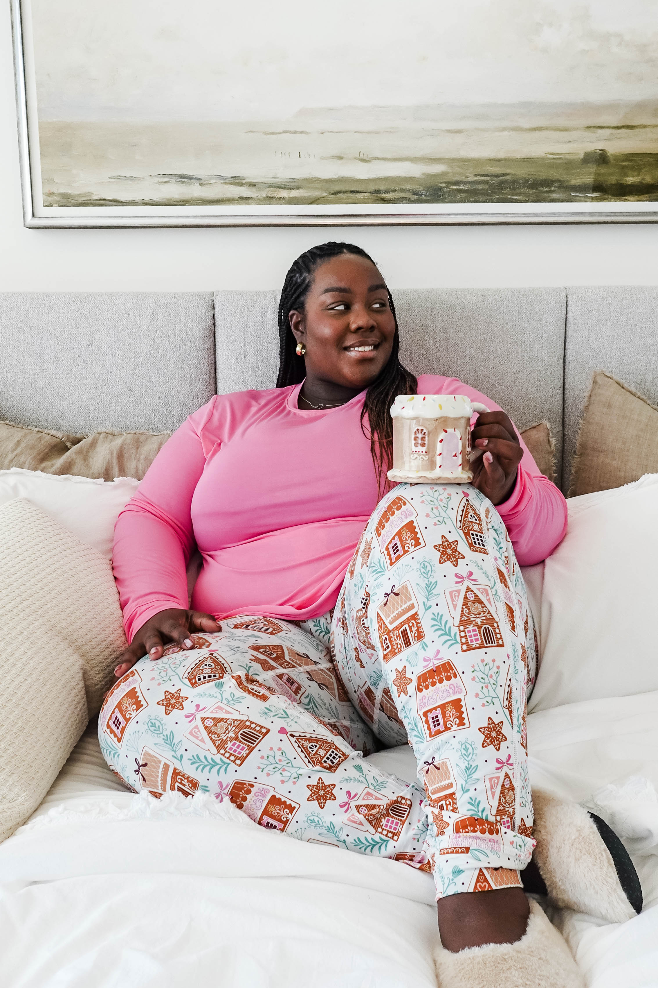 Cozy scene featuring a model enjoying a drink in Gingerbread Dreams Long Sleeve & Jogger PJ Set Bamboo by Georgia Rylan.