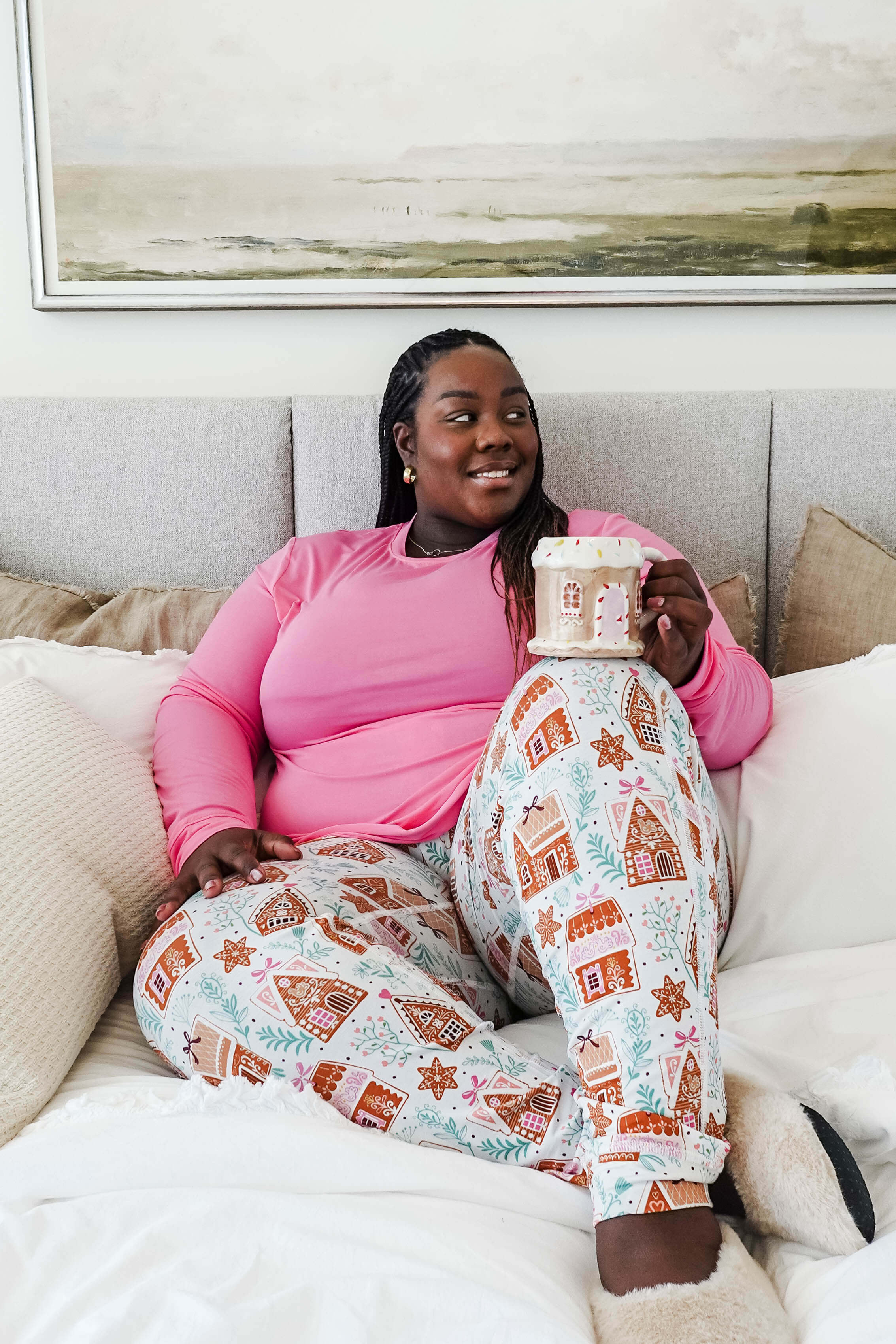 Cozy scene featuring a model enjoying a drink in Gingerbread Dreams Long Sleeve & Jogger PJ Set Bamboo by Georgia Rylan.