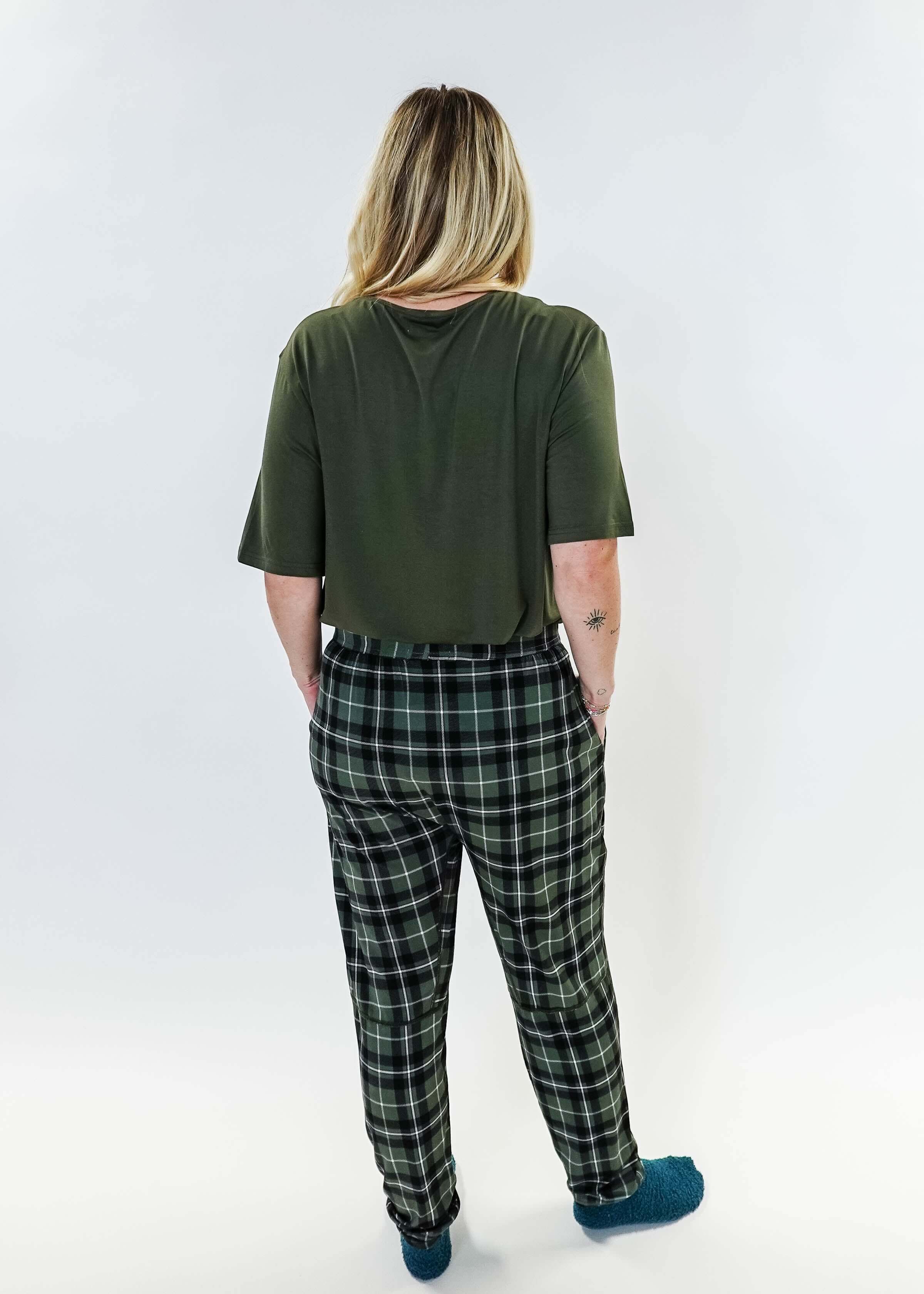Back view of a person wearing the Green Plaid Unisex Bamboo Jogger from Bob's Sleepwear Co., featuring a comfortable style.