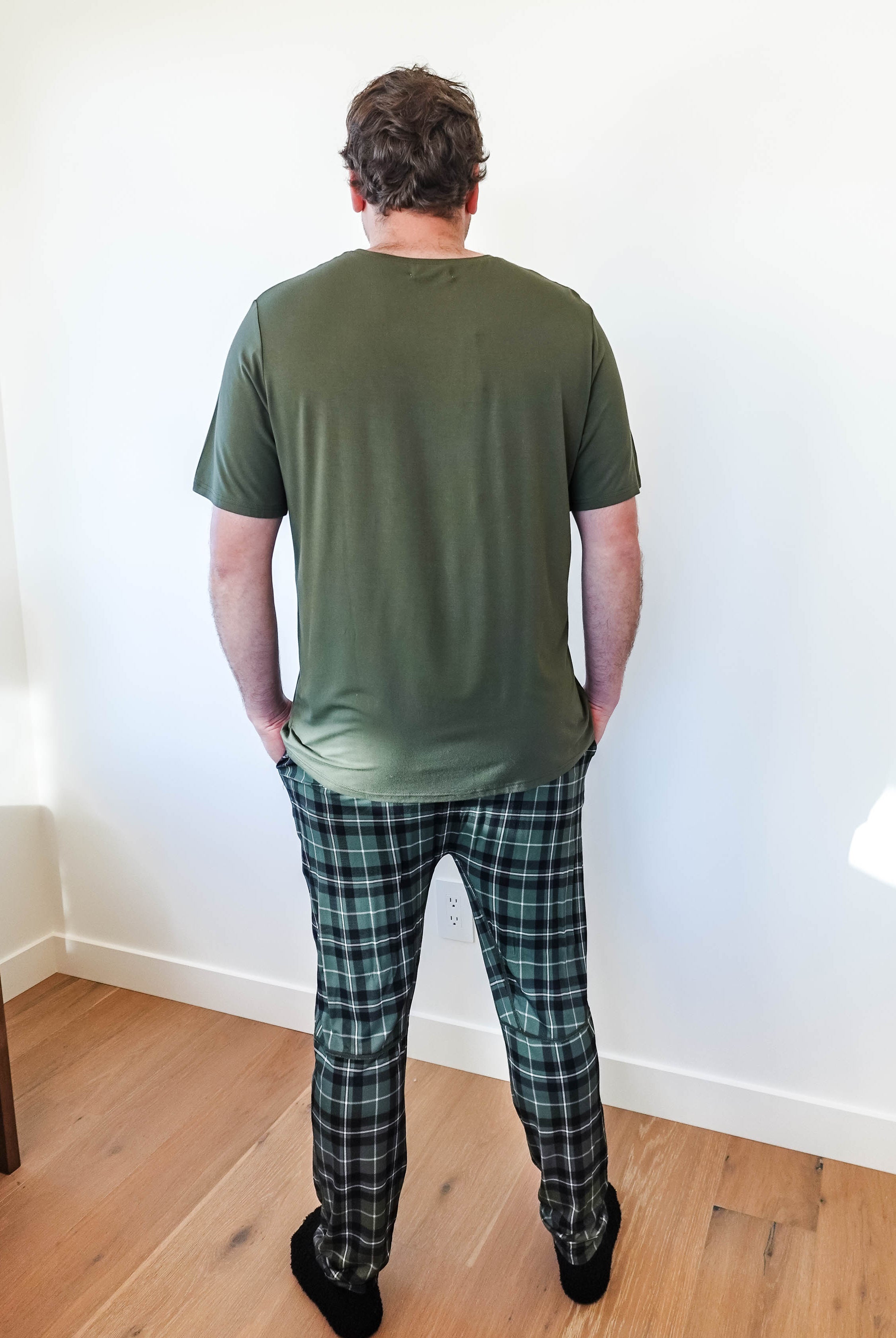 Man wearing Green Plaid unisex bamboo jogger from Bob's Sleepwear Co. shown from the back.