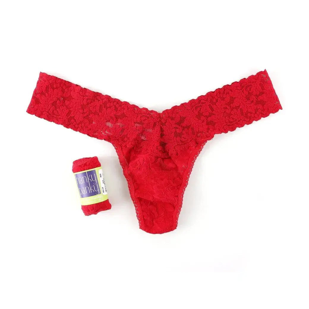 Hanky Panky Low Rise Thong in red lace next to a gift-ready wrap, perfect for special occasions.