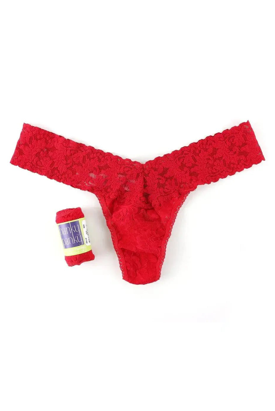 Hanky Panky Low Rise Thong in red lace next to a gift-ready wrap, perfect for special occasions.