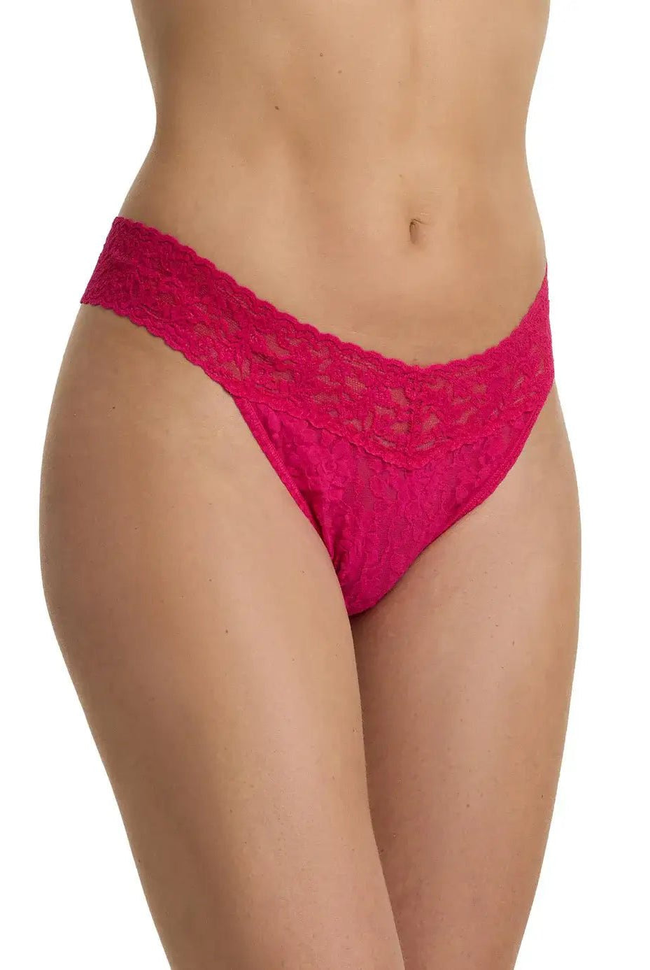 Hanky Panky Original Rise Thong in bright pink lace on a model's waist, showcasing signature lace design.