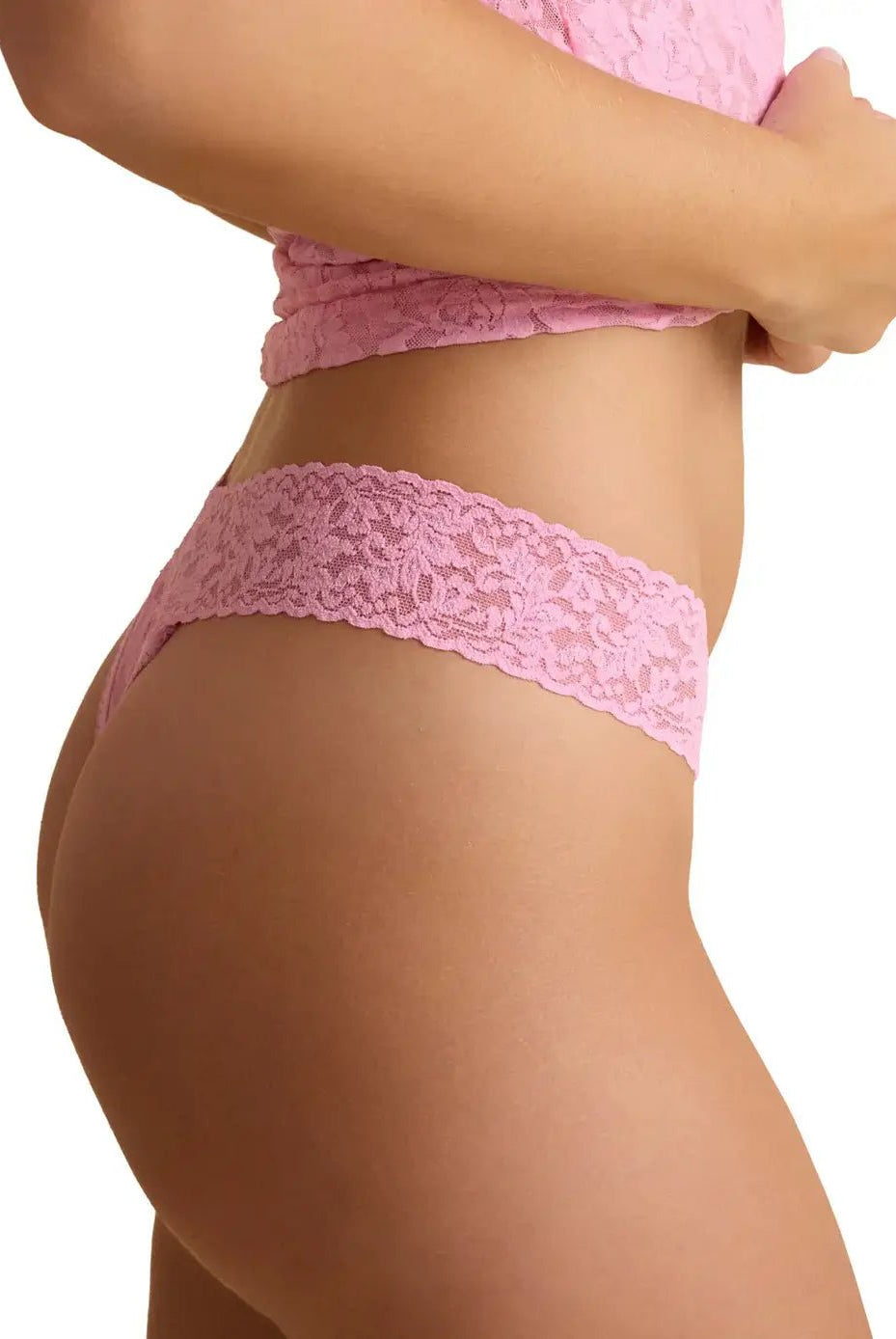 Hanky Panky Original Rise Thong in pink lace, showing side view and detail of the signature lace design