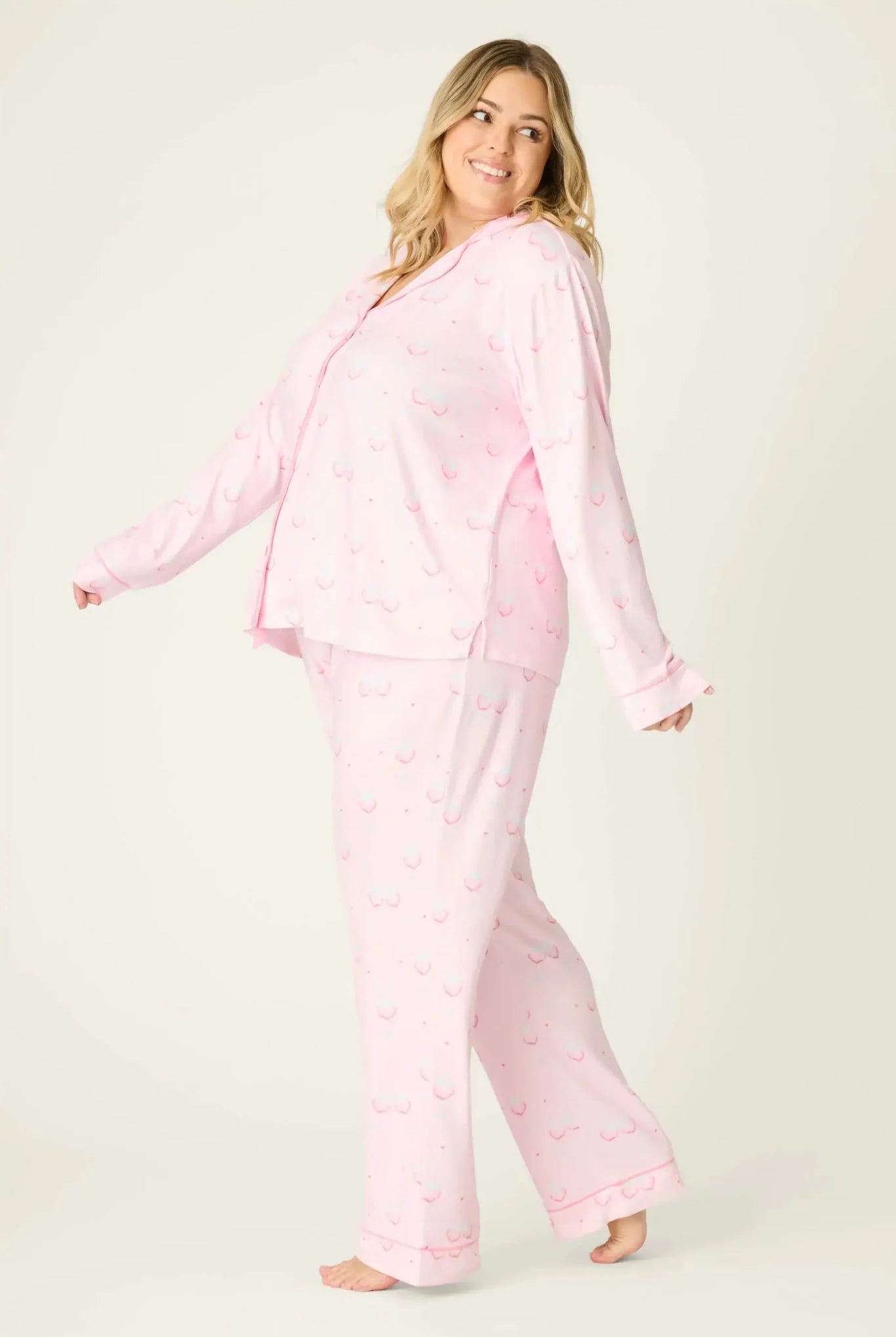 Happy Hour Wine Glass Print 3-Piece PJ Set Plus Size Inclusive model wearing playful pink pajama set with wine glass pattern, side view
