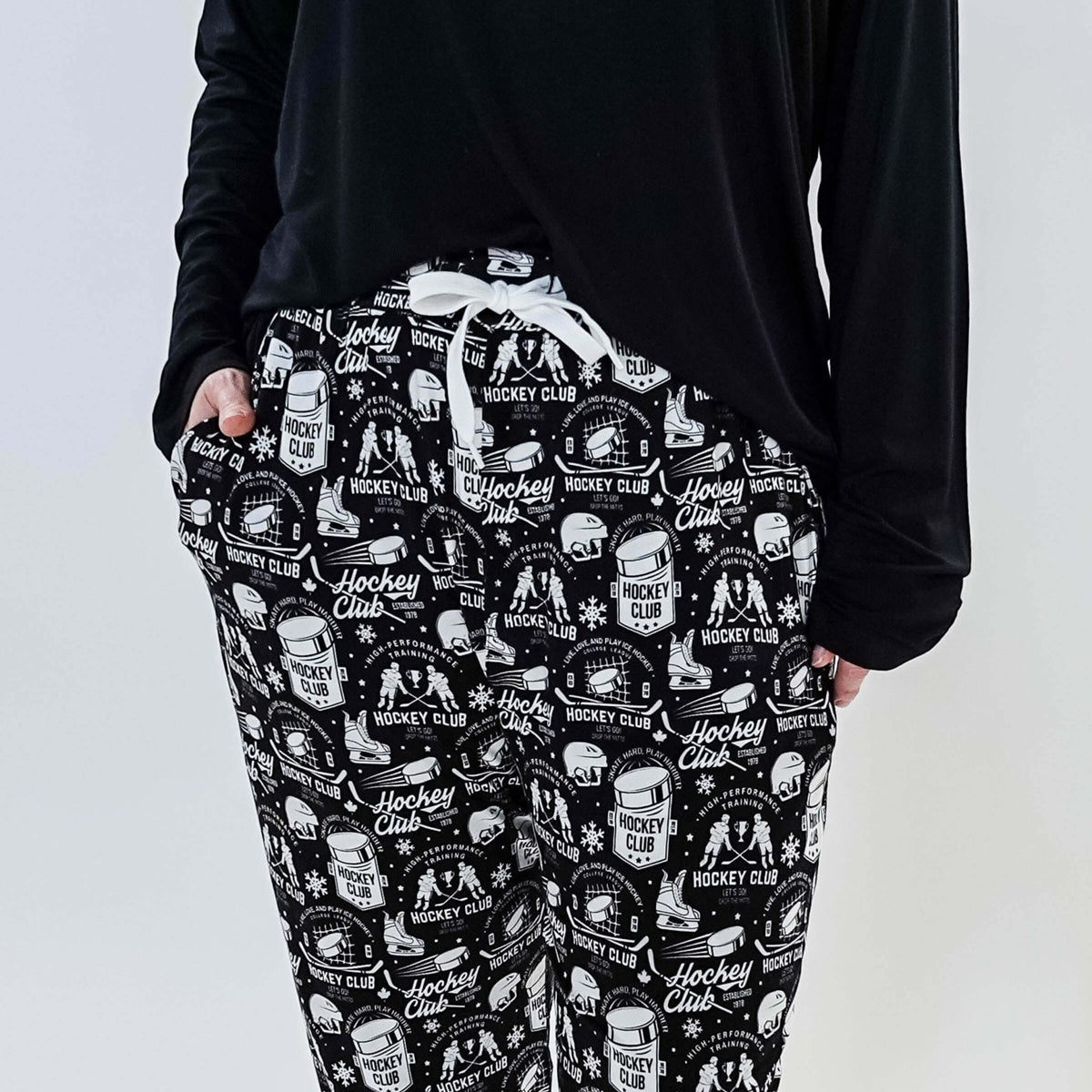 He Scores Hockey Print Unisex Bamboo Jogger featuring a hockey-themed design in black and white.