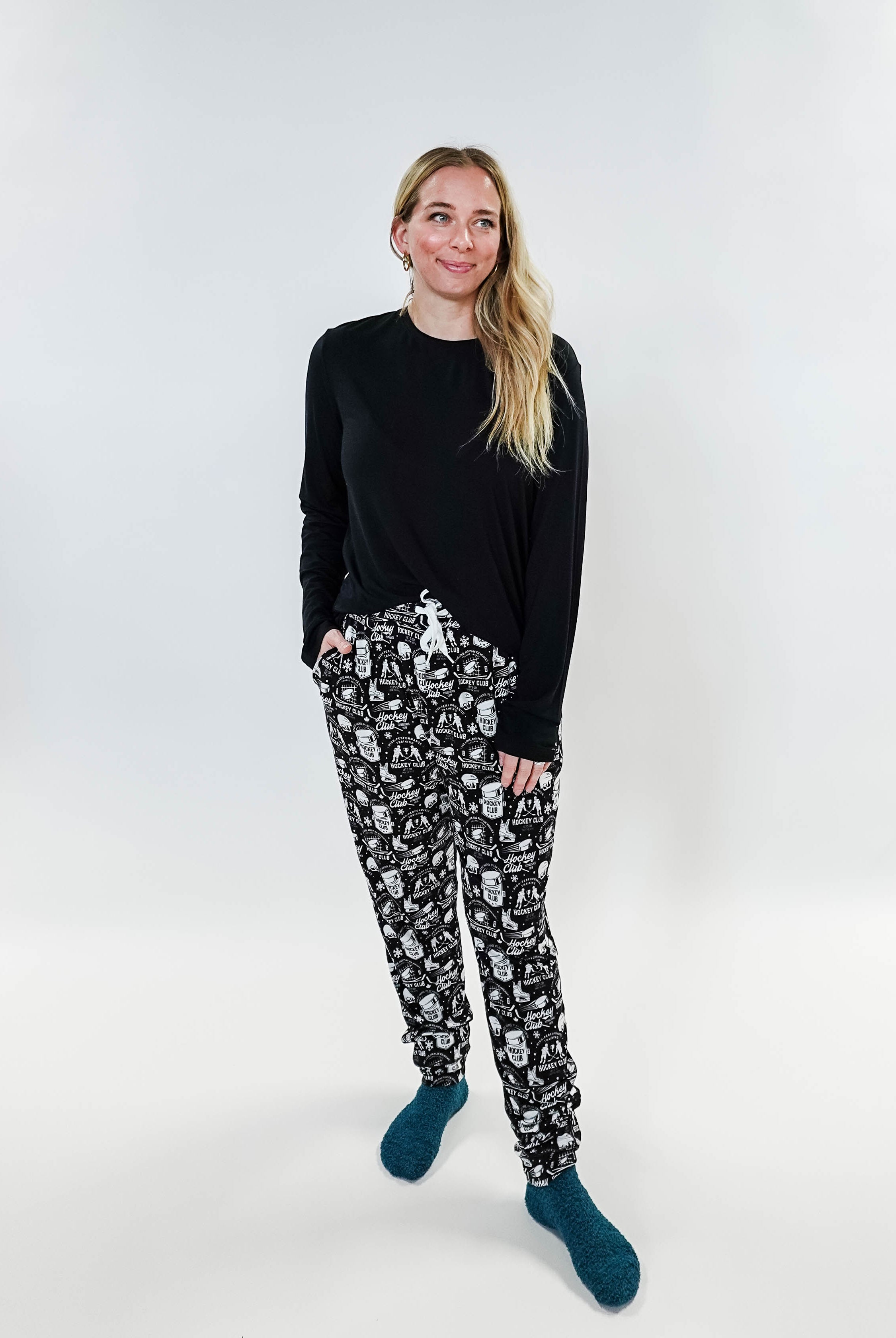 He Scores Hockey Print Unisex Bamboo Jogger worn by a model, showcasing a comfortable and stylish design.