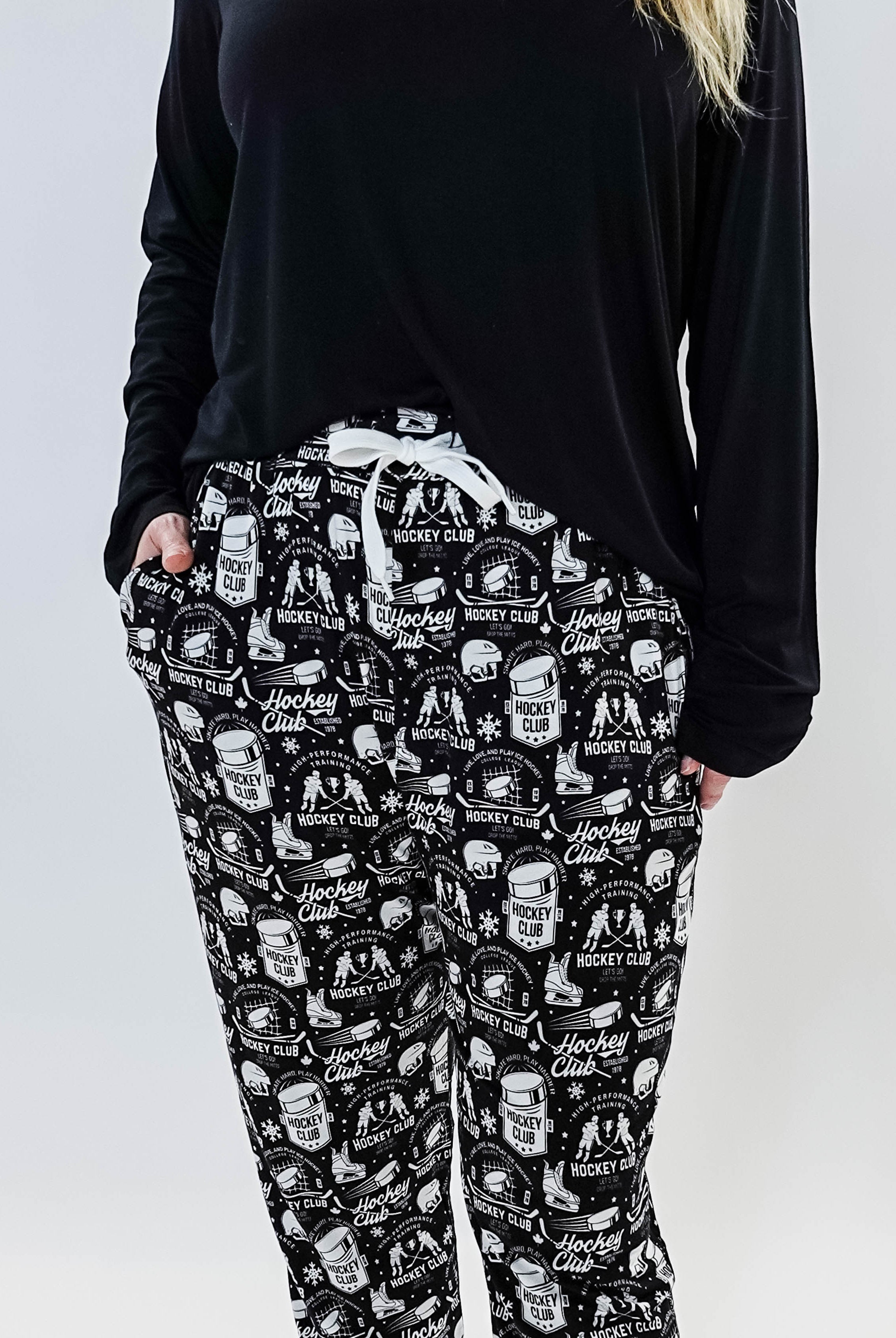 He Scores Hockey Print Unisex Bamboo Jogger featuring a hockey-themed design in black and white.