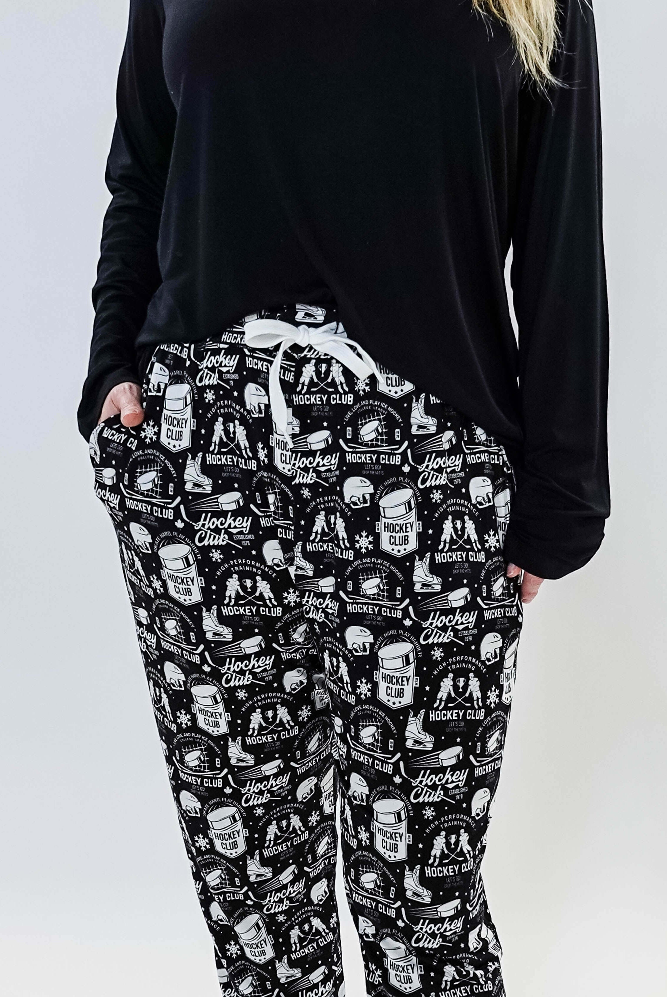 He Scores Hockey Print Unisex Bamboo Jogger featuring a hockey-themed design in black and white.