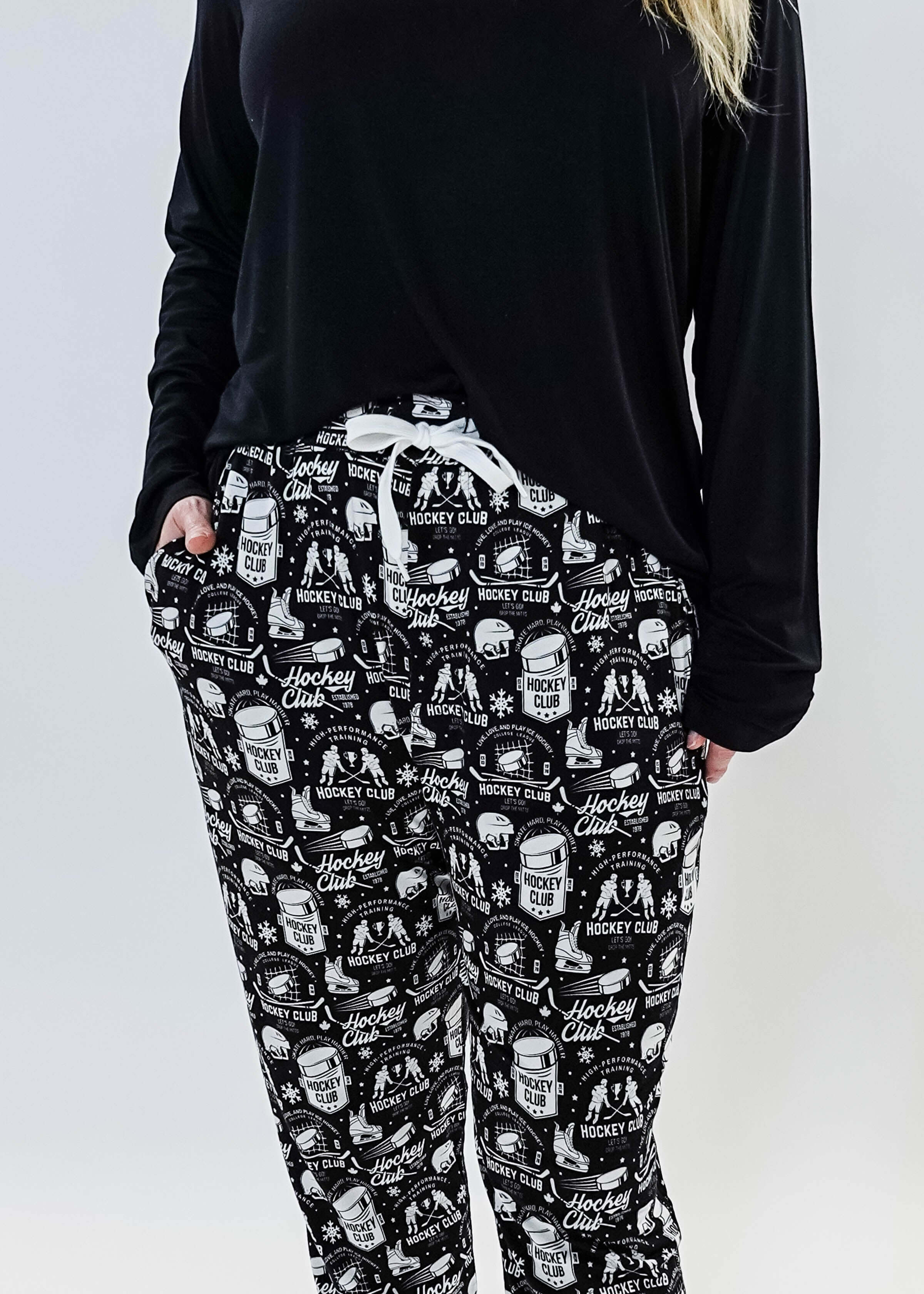 He Scores Hockey Print Unisex Bamboo Jogger featuring a hockey-themed design in black and white.