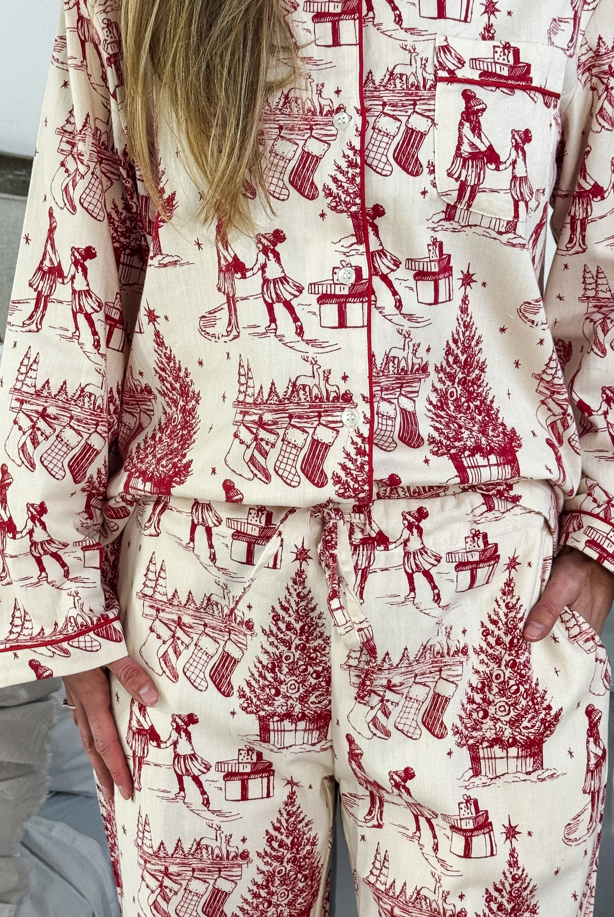 Woman wearing the Holiday Memories Flannel Button-Up PJ Set showcasing festive print with holiday designs.