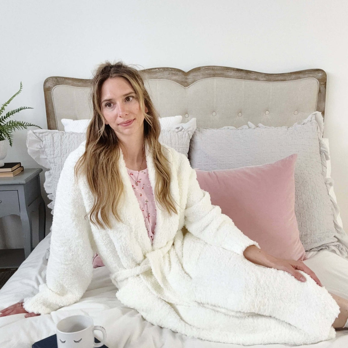 Ivory Chenille Cloud Spa Blanket Robe | Ultra Soft shown on model on a bed
