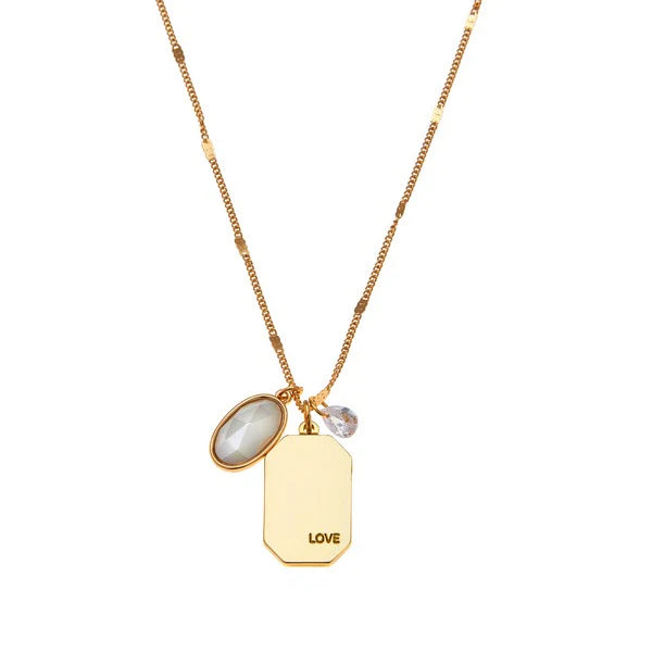 Birthstone Charm Necklace in 14k Plated Gold for JUNE featuring a pearl and 'LOVE' charm on a blue card by Foxy Originals.