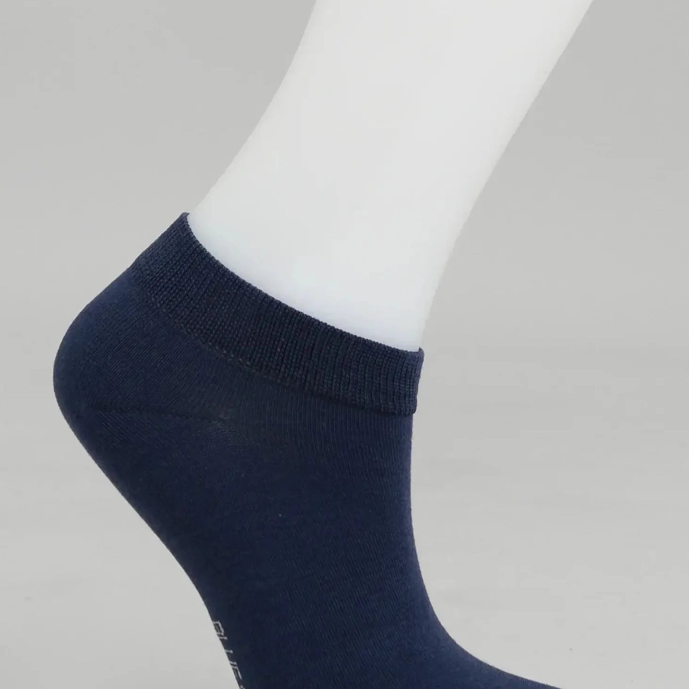 Ladies Bamboo Ankle Socks displayed on a mannequin foot, showcasing soft and moisture-wicking trainer design.