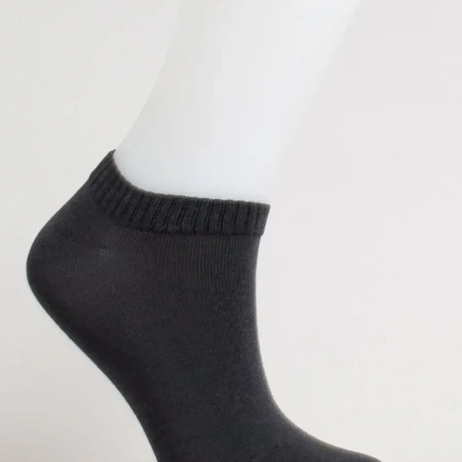Ladies Bamboo Ankle Socks in dark gray displayed on a mannequin foot, showcasing a soft and comfortable design.