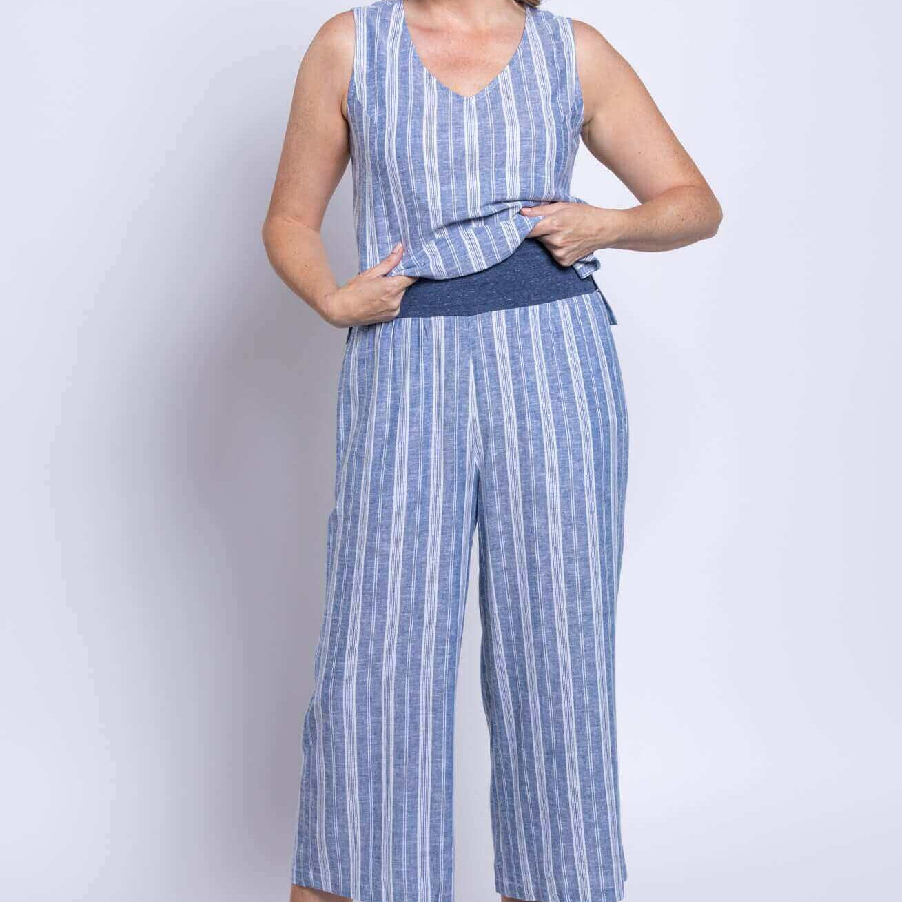 Model wearing Landon Capri striped linen-bamboo wide-leg cropped pant in blue, showcasing effortless coastal style.