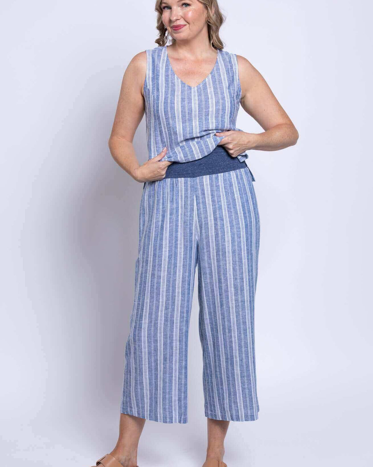 Model wearing Landon Capri striped linen-bamboo wide-leg cropped pant in blue, showcasing effortless coastal style.