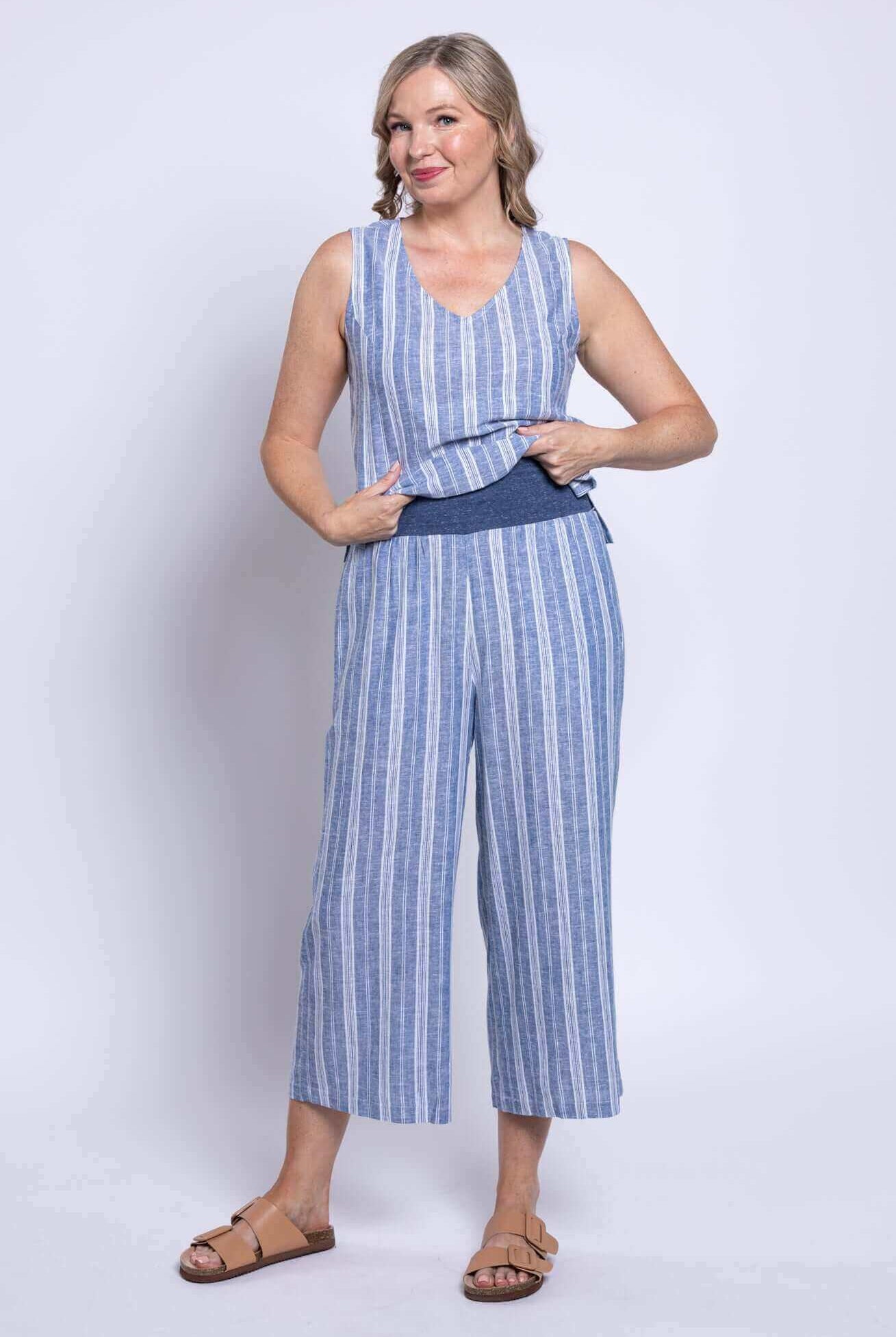 Model wearing Landon Capri striped linen-bamboo wide-leg cropped pant in blue, showcasing effortless coastal style.