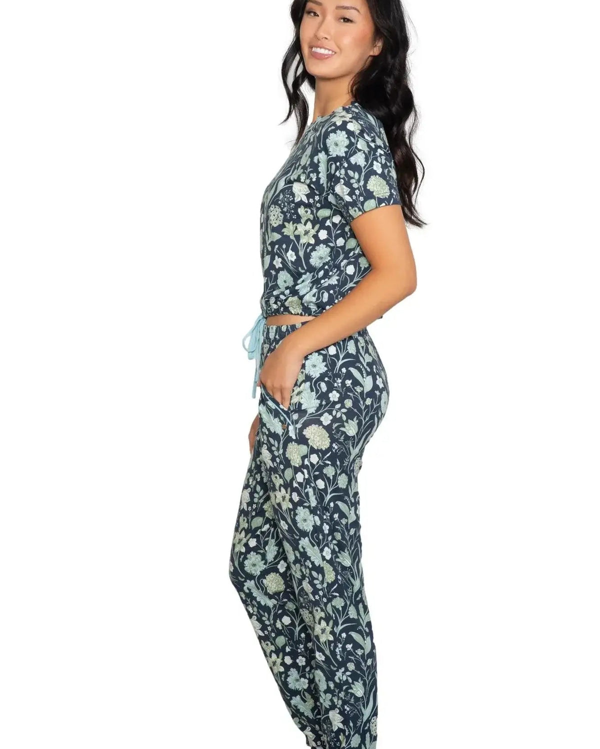 Latte Love Floral Print Cotton-Modal Relaxed Set Drop Shoulder Tee & Jogger Set modeled by a woman in profile.